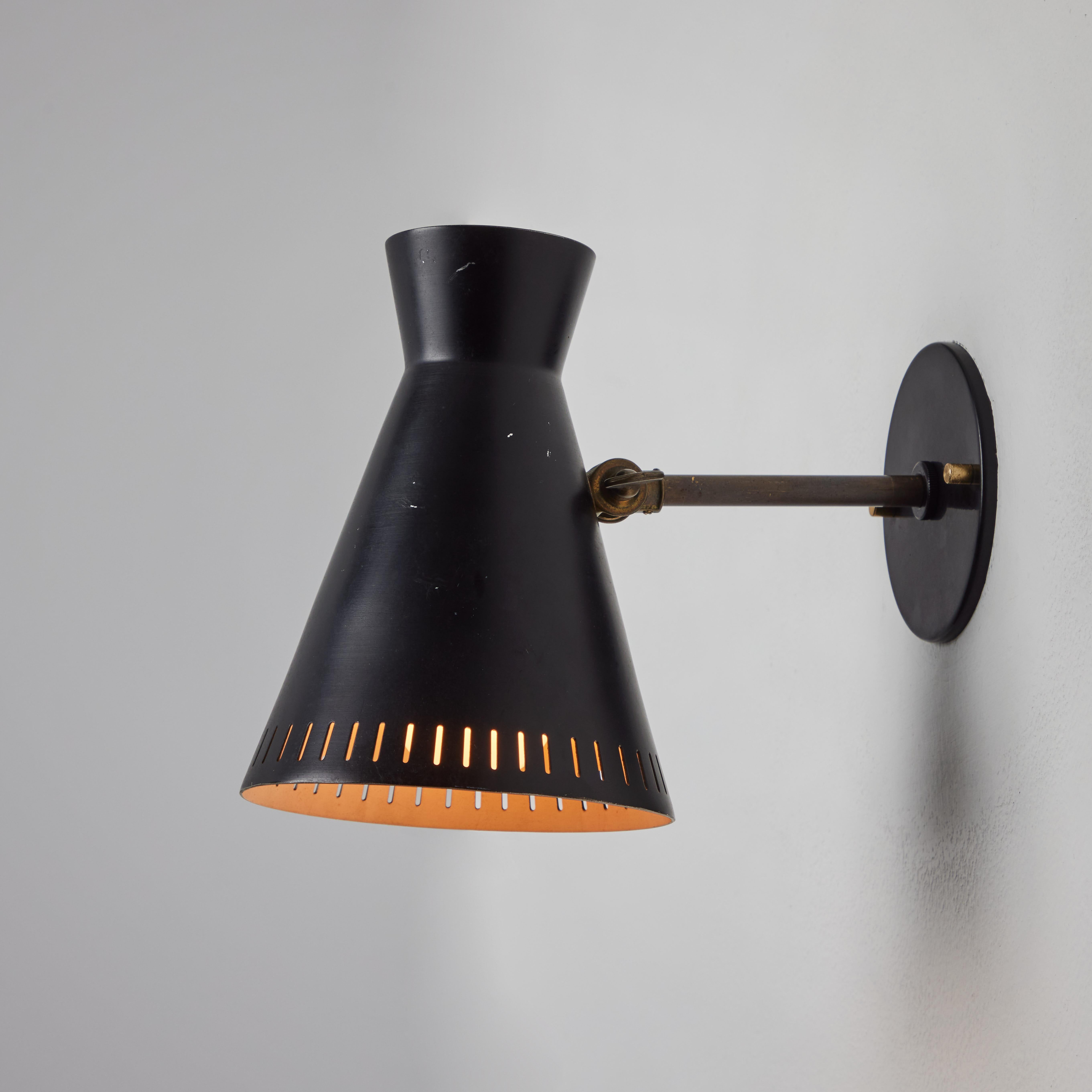 Mid-20th Century 1950s Perforated Black Metal Diabolo Wall Lamp Attributed to Mauri Almari For Sale