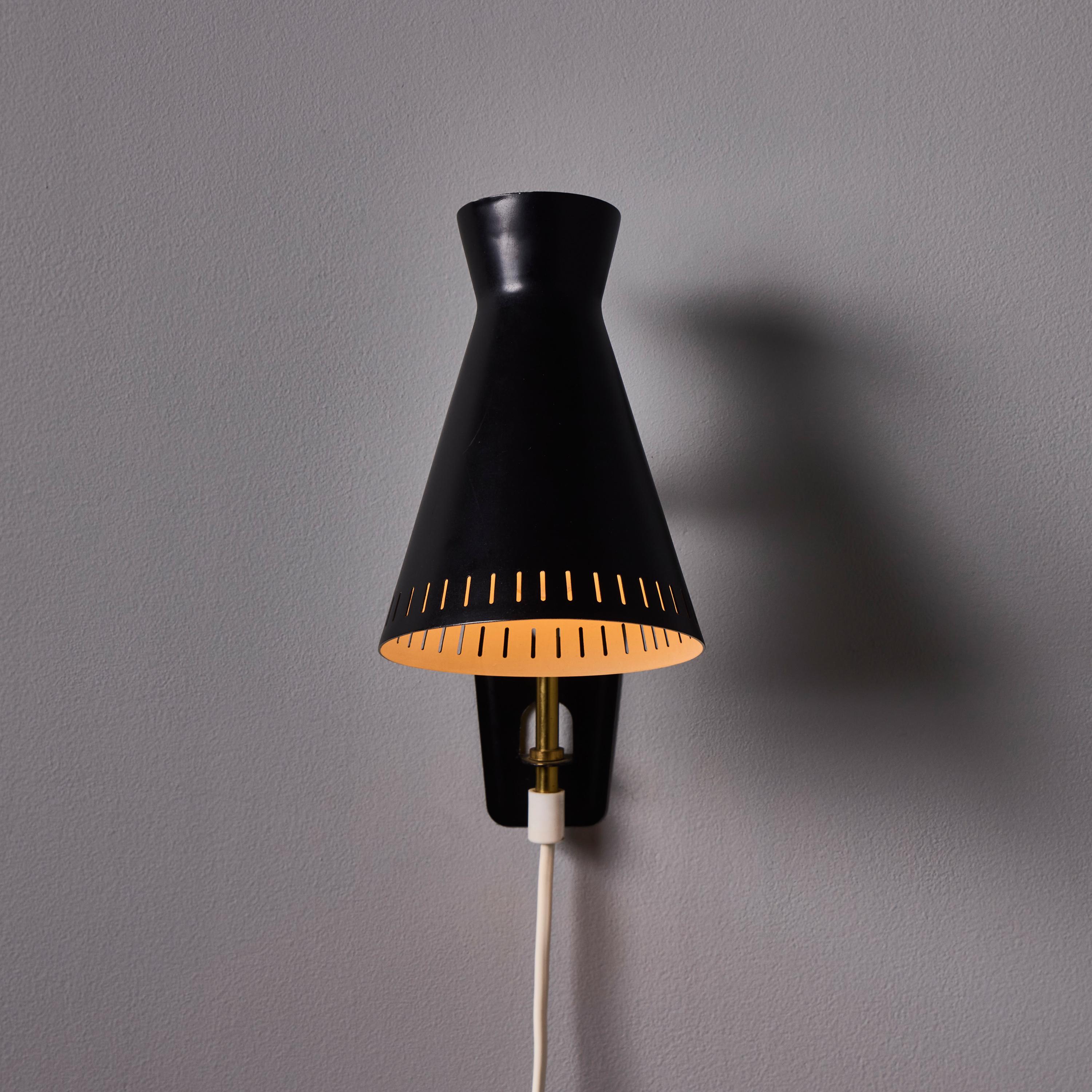 Scandinave moderne 1950s Perforated Metal Diabolo Plug-In Wall Lamp Attributed to Mauri Almari en vente