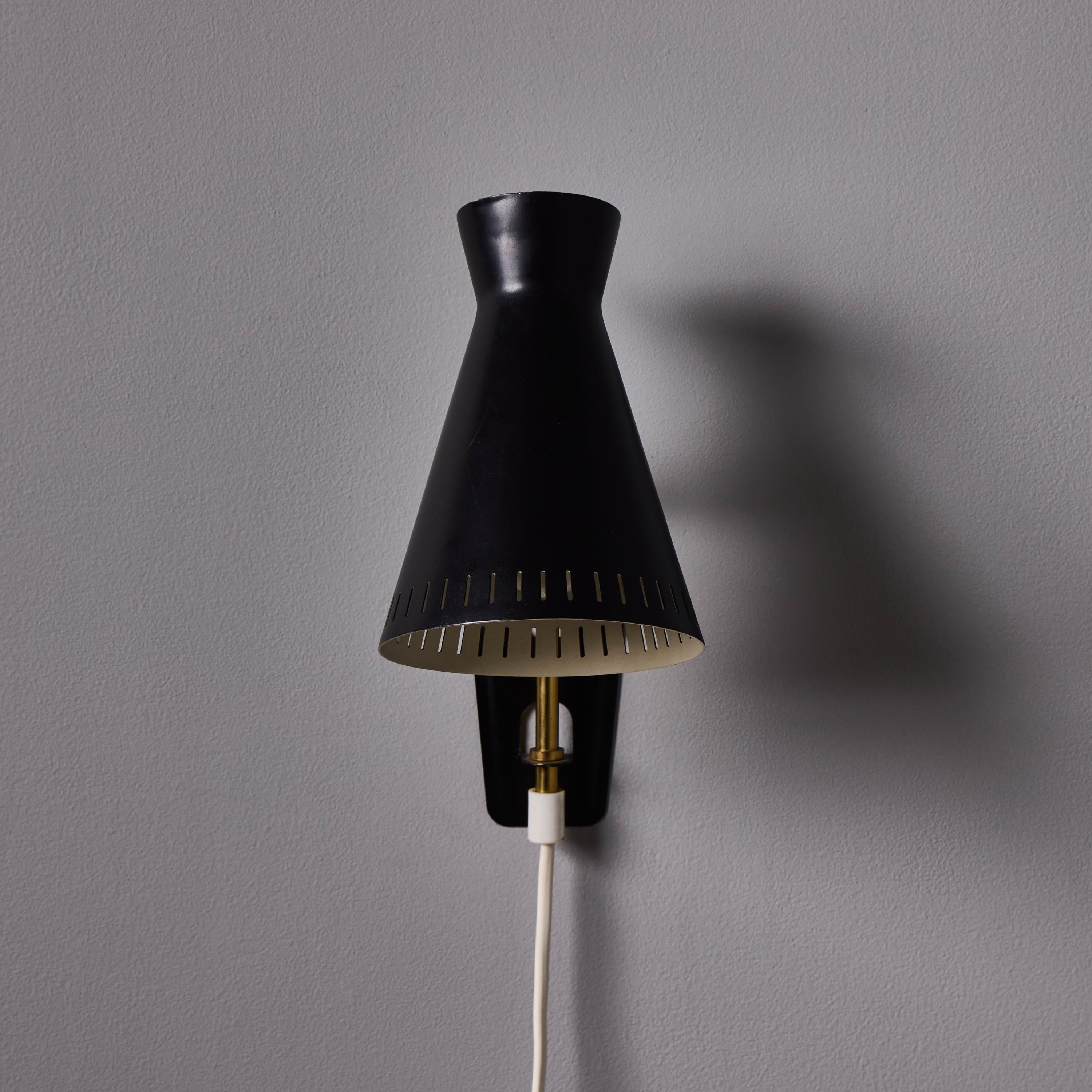 Peint 1950s Perforated Metal Diabolo Plug-In Wall Lamp Attributed to Mauri Almari en vente