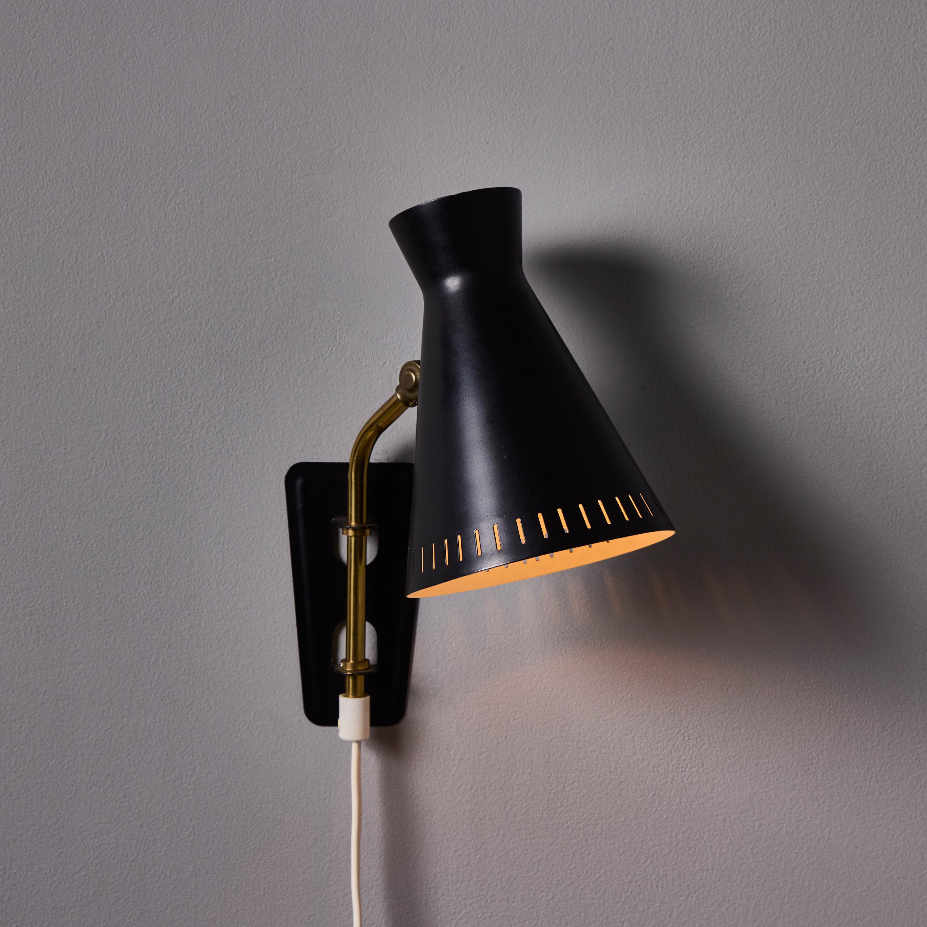 Métal 1950s Perforated Metal Diabolo Plug-In Wall Lamp Attributed to Mauri Almari en vente