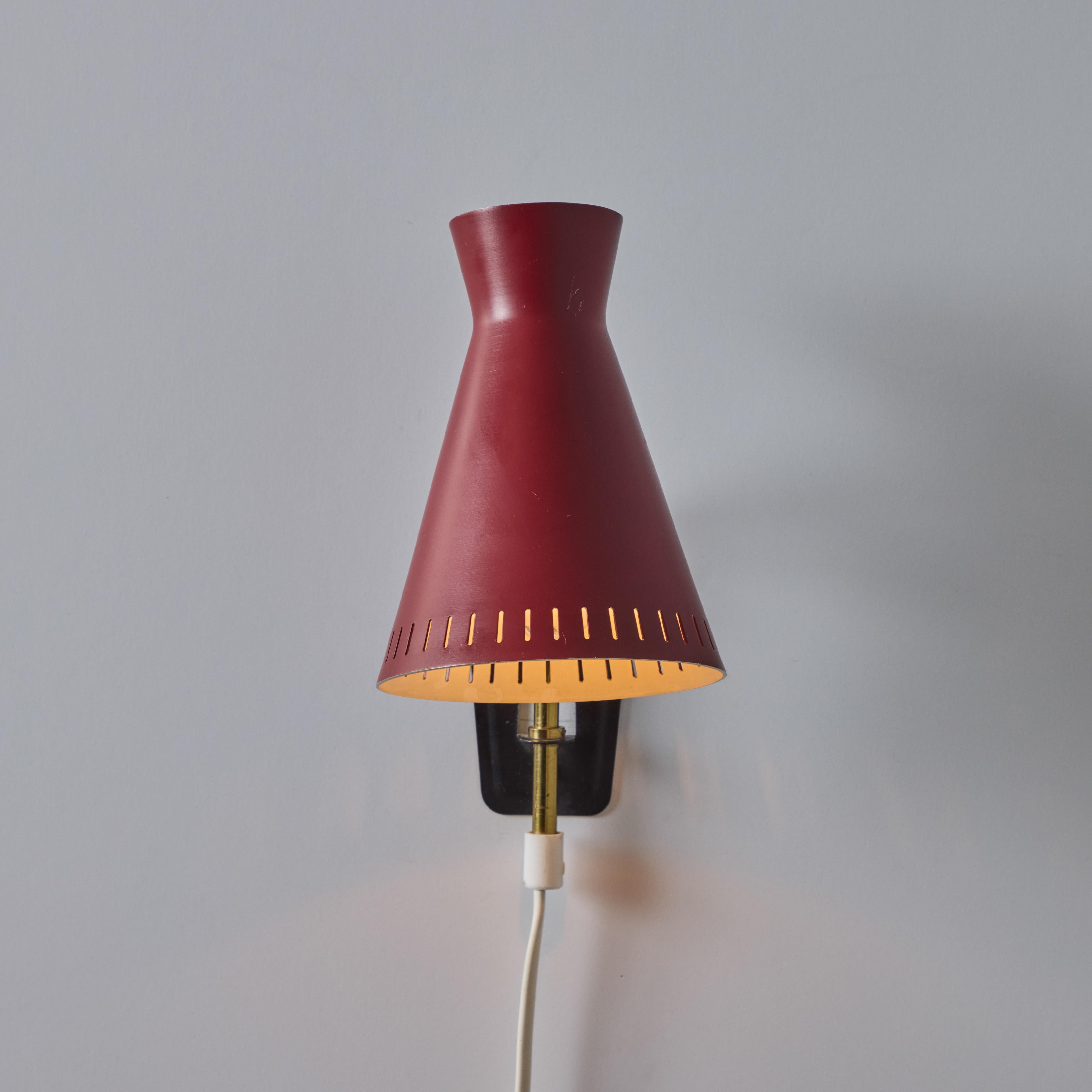 Swedish 1950s Perforated Red Diabolo Plug-In Wall Lamp Attributed to Mauri Almari For Sale