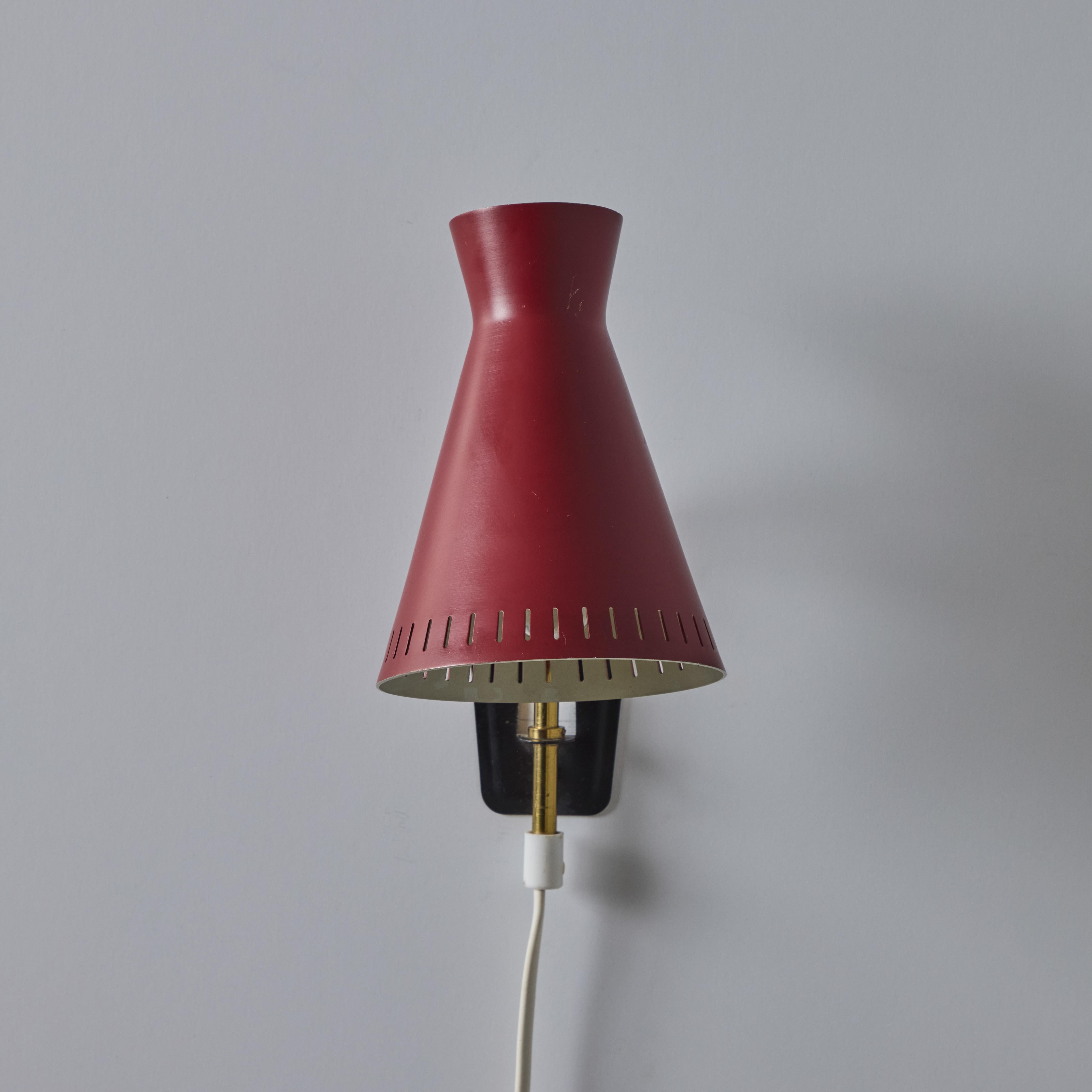 Painted 1950s Perforated Red Diabolo Plug-In Wall Lamp Attributed to Mauri Almari For Sale
