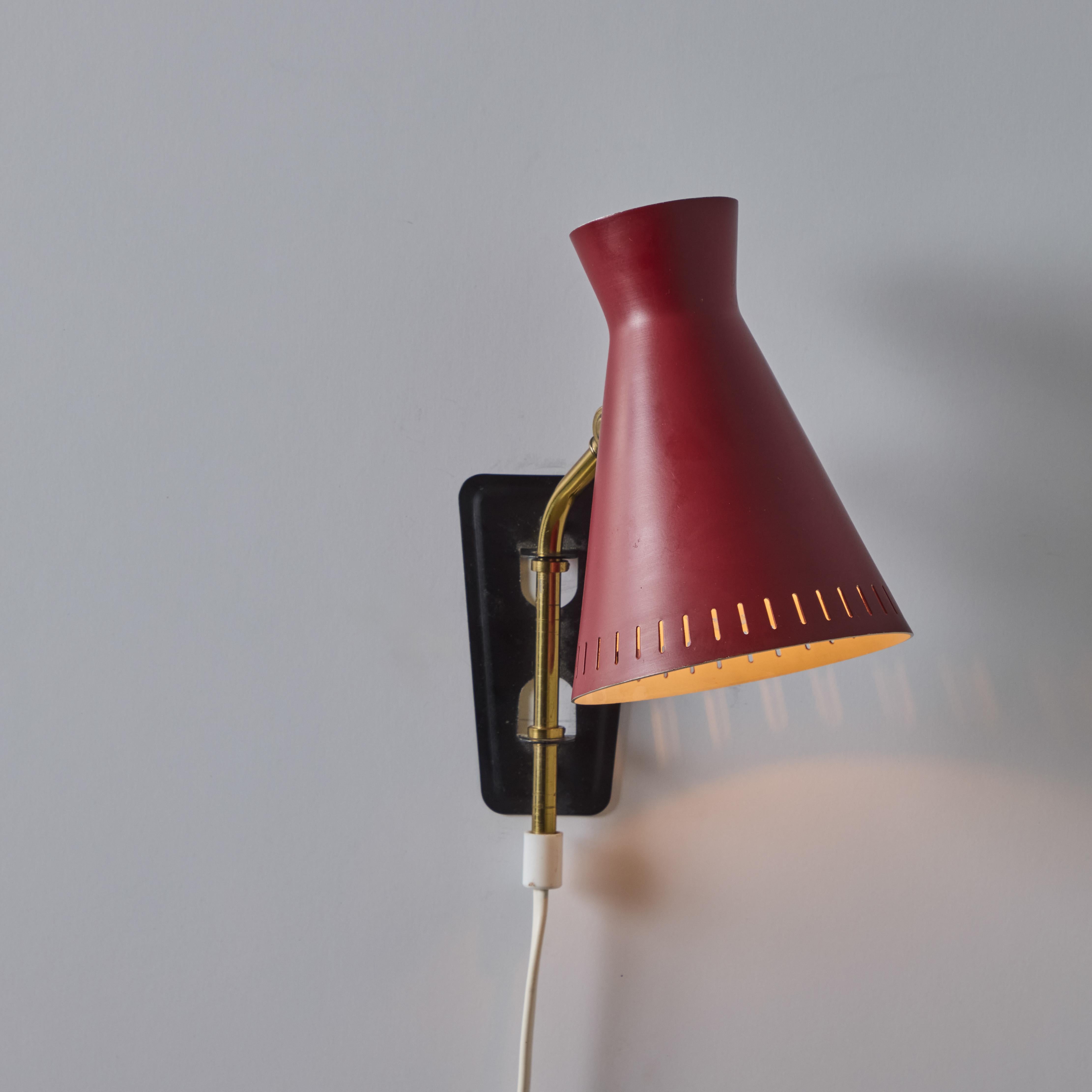 1950s Perforated Red Diabolo Plug-In Wall Lamp Attributed to Mauri Almari In Good Condition For Sale In Glendale, CA