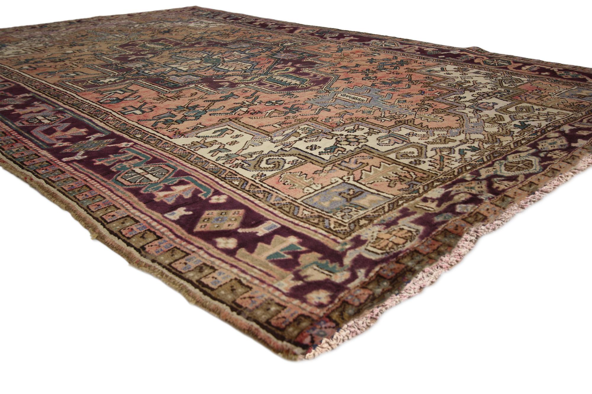 75553 Vintage Persian Heriz Rug, 05'10 x 09'00. Steeped in tradition and softened by time, this hand-knotted wool vintage Persian Heriz rug captures the enduring beauty of northwestern Iran’s most celebrated weavings. An antique wash gently mutes
