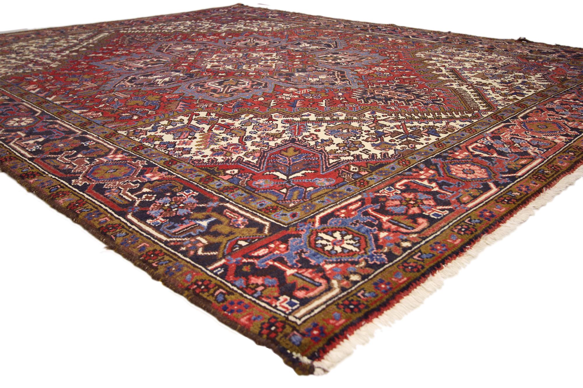 74698 Vintage Persian Heriz Rug, 06'08 x 08'05. Woven in the loom of time and tradition, this hand-knotted wool vintage Persian Heriz rug emerges like a lyrical tableau of history and harmony. Its bold octofoil medallion—symmetrical and finely