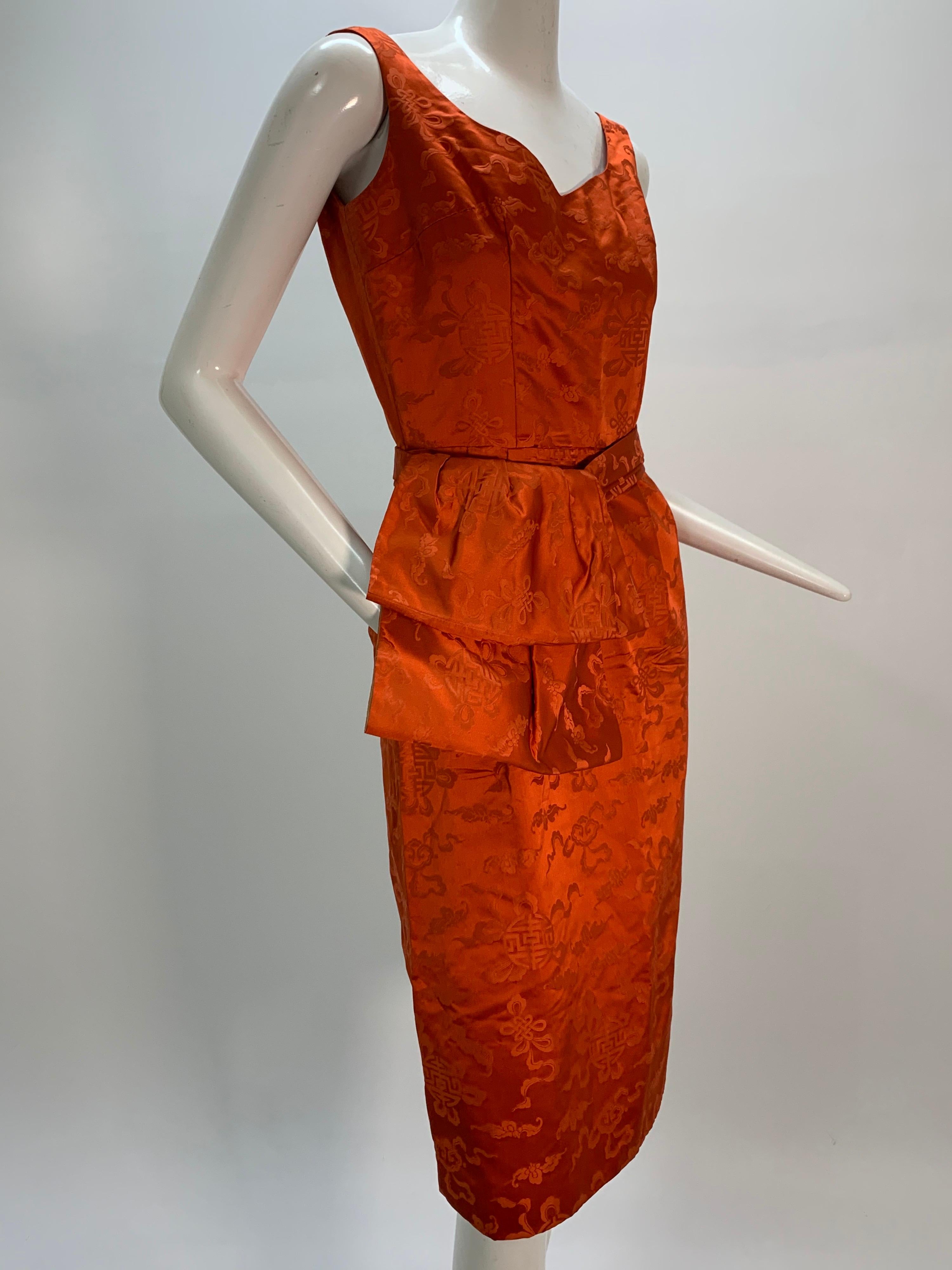 A beautiful, vibrant 1950s persimmon color Hong Kong silk jacquard sleeveless sheath dress with low V-cut back and detachable obi-inspired belt. Zip back. Jin Chon H.K. fabric.