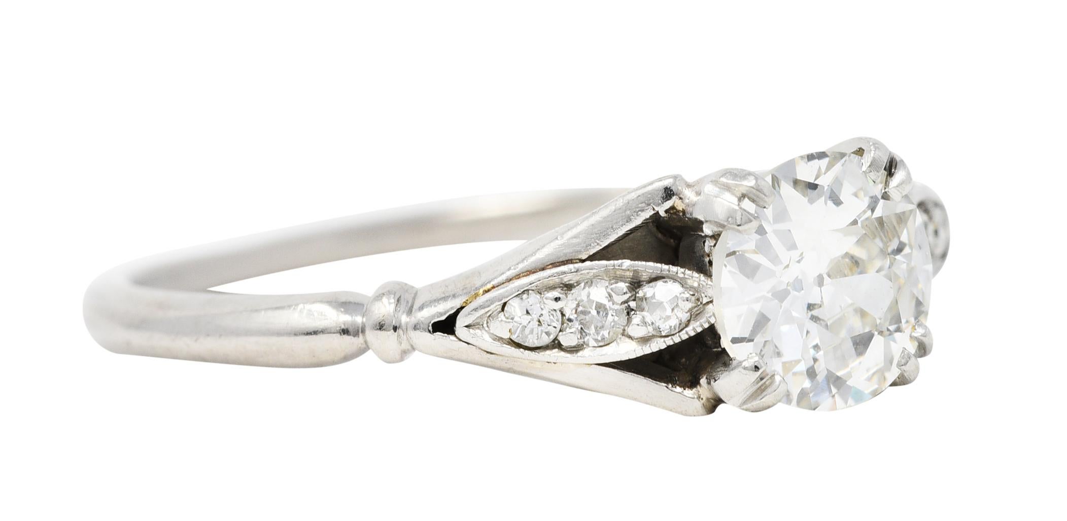 Centering an old European cut diamond weighing approximately 0.65 carat - J color with VS clarity

Basket set with split prongs and flanked by stylized navette shoulders

Accented by single cut diamonds weighing approximately 0.10 carat - eye clean