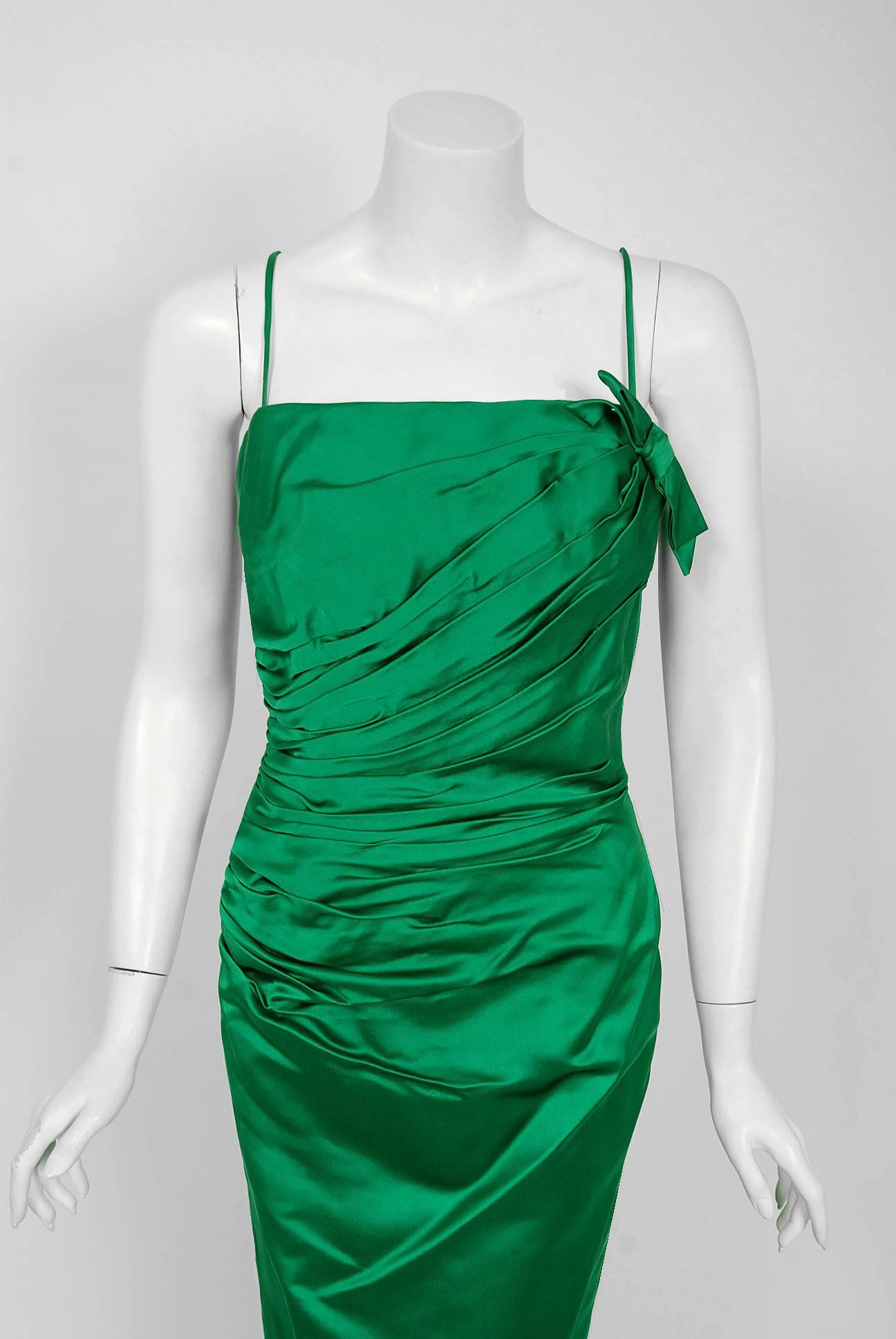 This is such a seductive and dramatic evening gown from the rare Philip Hulitar Old Hollywood designer label. Perfect for any upcoming event; you can't help but feel feminine in this beauty! The garment is fashioned from stunning mid-weight emerald