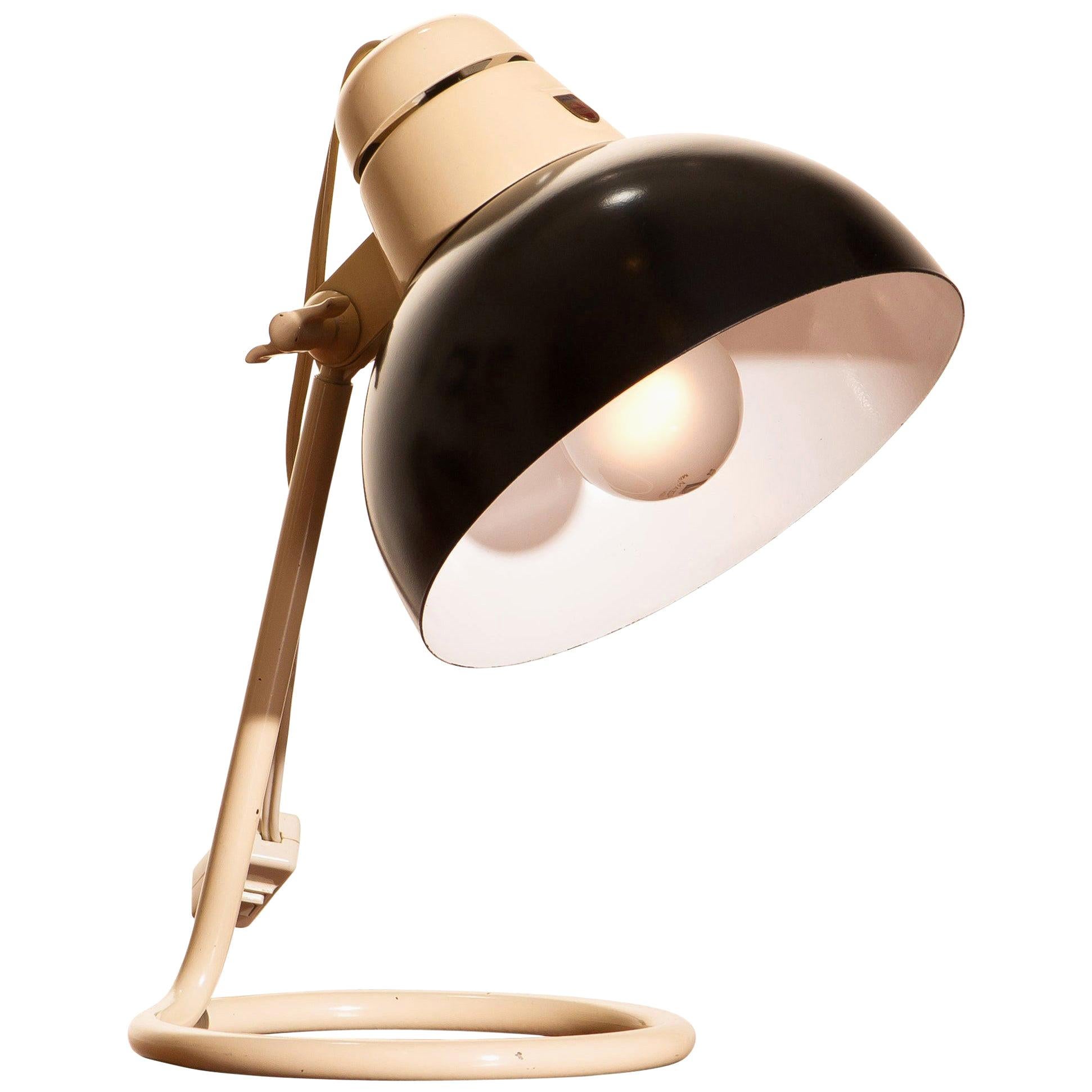 Beautiful desk or table lamp in off-white and black lacquered metal and in very nice condition produced by Philips.
Labelled.
Period: 1950
The dimensions are height 33 cm, 13 inch, diameter shade 20 cm, 8 inch.