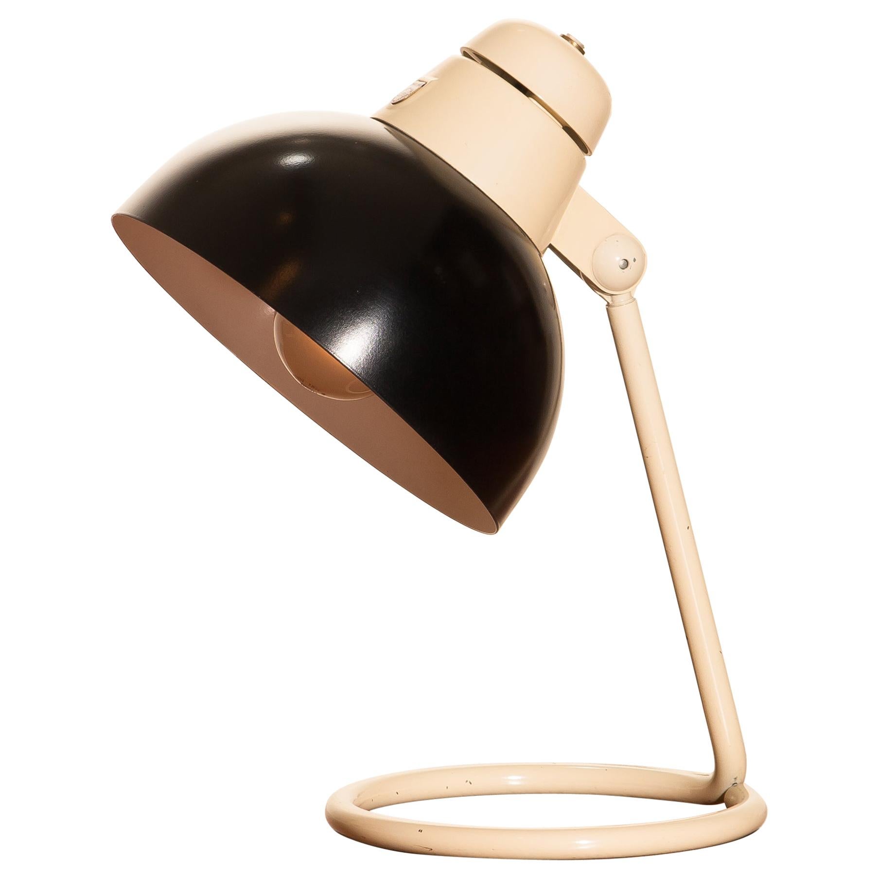 Beautiful desk or table lamp in off-white and black lacquered metal and in very nice condition produced by Philips.
Labelled.
Period: 1950
The dimensions are height 33 cm, 13 inch, diameter shade 20 cm, 8 inch.