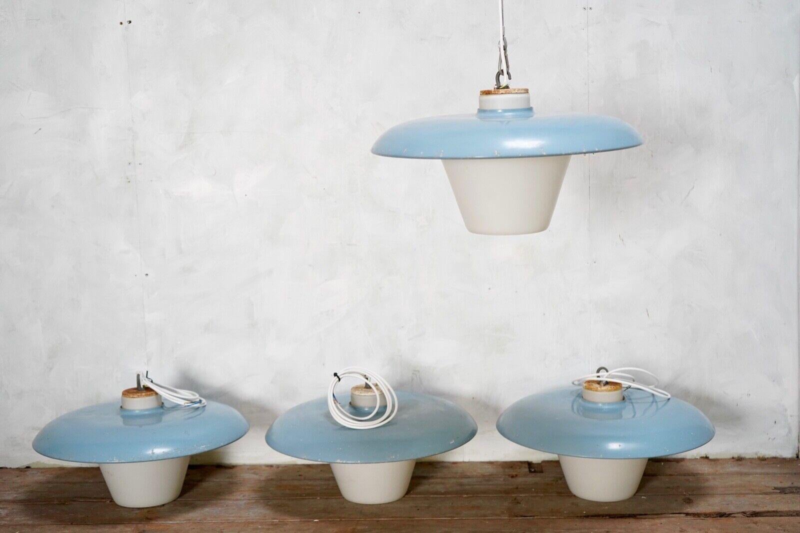 Blue Sheet metal & opaline glass pendant by Philips.
The blue metal shade sits on top of the opaline diffuser spilling out light from the top and bottom.
Price is per pendant. We have 4 available.
The shades do have a few blemishes.
Rewired and pat