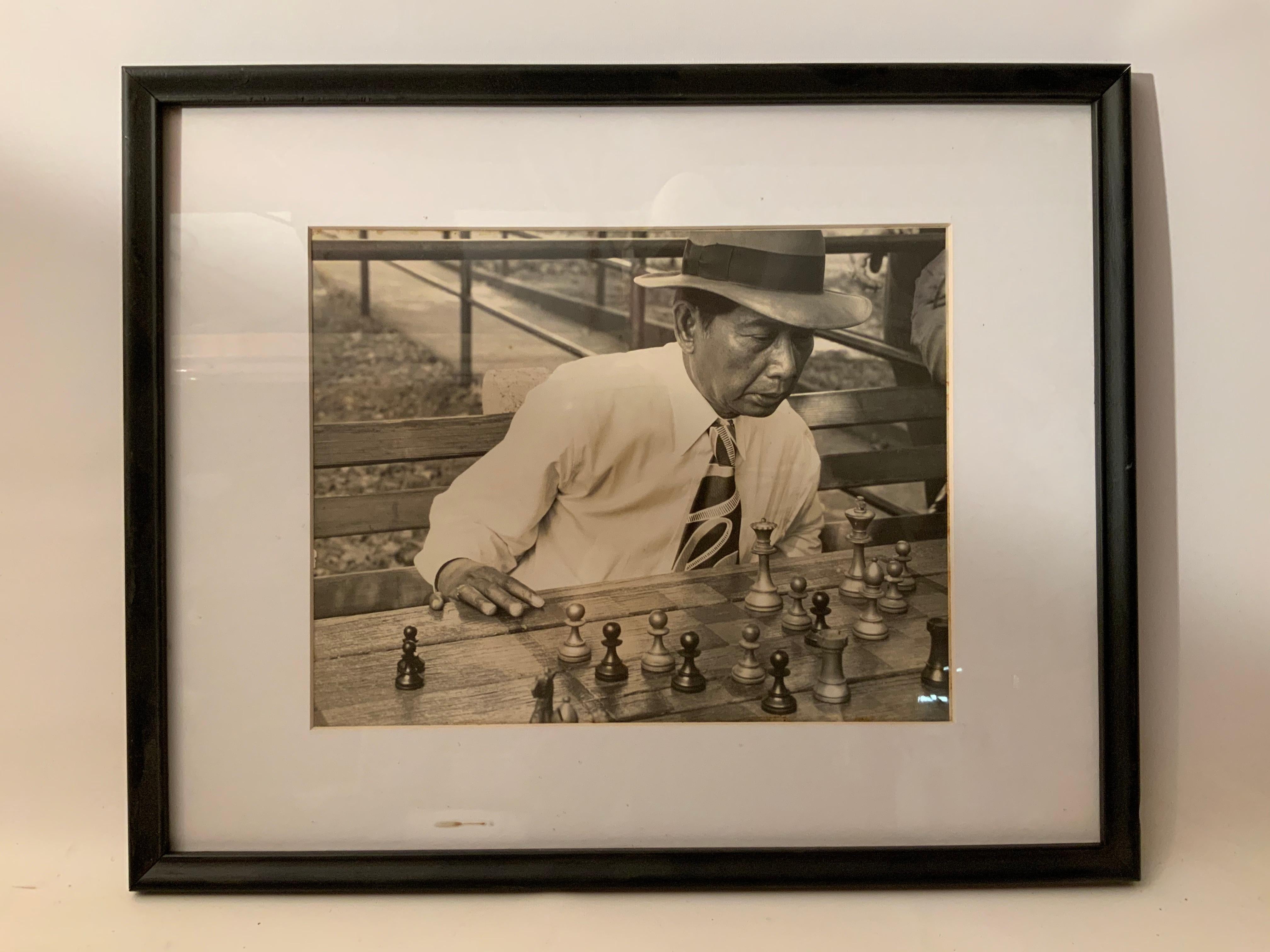 Excellent image and composition in black and white photography of a chess player taken in Mexico City, circa 1950. Framed, glazed and matted. The photo was taken by architect, teacher, and amateur designer and photographer, Raymond Groce. Groce and