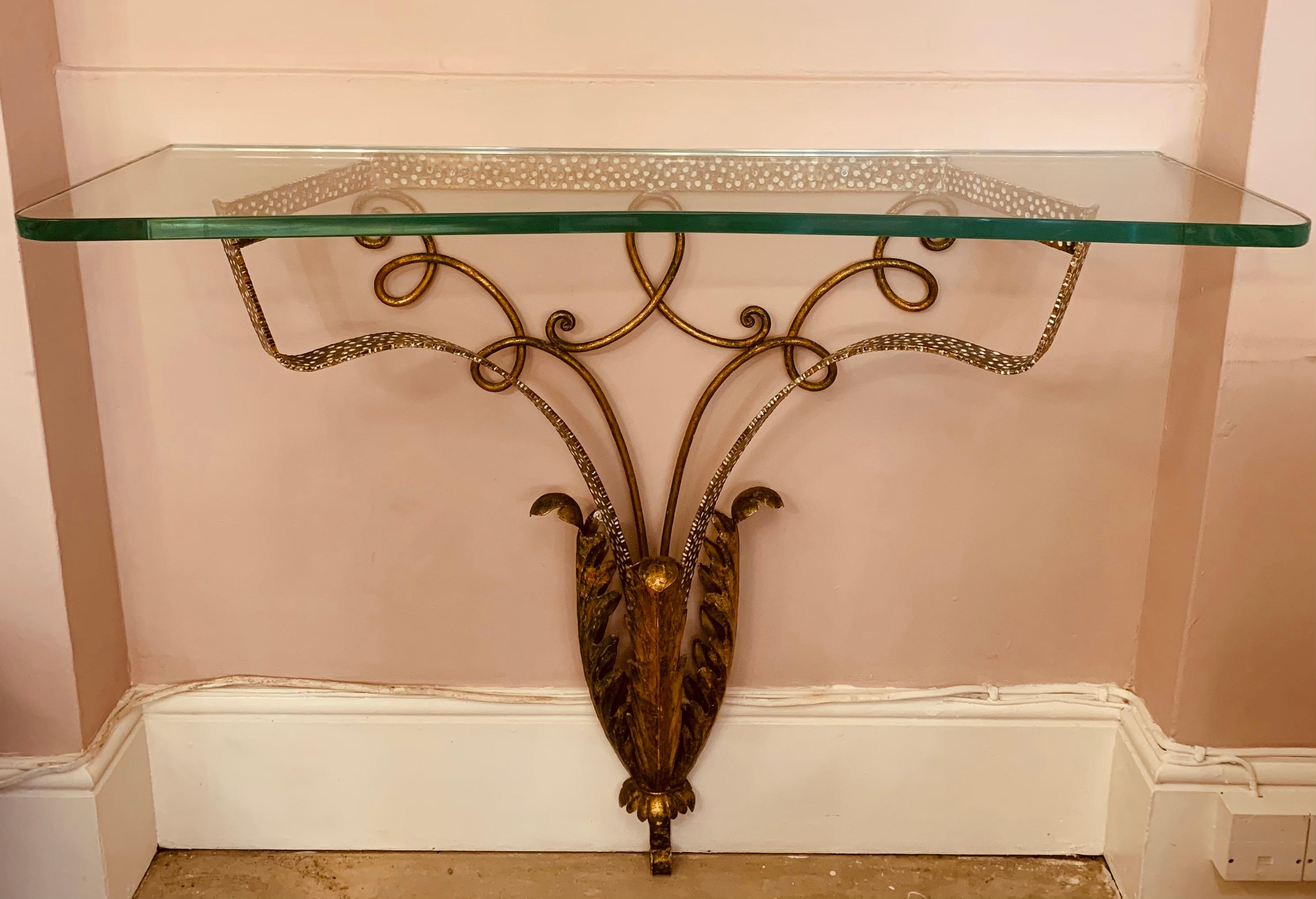 A striking and highly decorative 1950s, Italian, Pier Luigi Colli, gold with white spotted detail, wrought iron, wall mounted, console table. The fun white spotted outer frame is accented with scrolled iron detailed metal work. The slim base