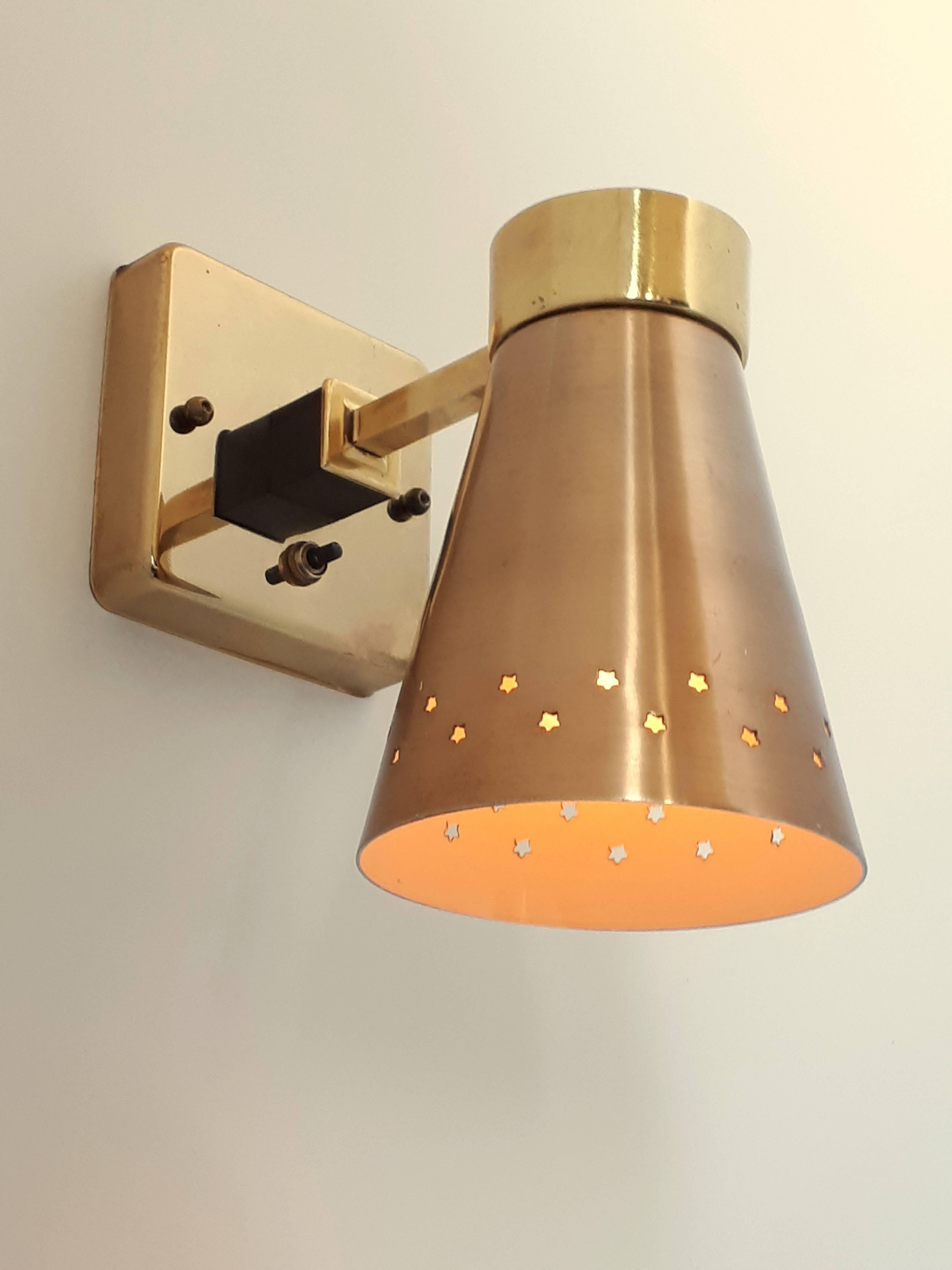 3 sconces available.

Star motif pierced shade in a copper tone. 

Base and arm are brass-plated. 

Rotating switch on base. 

Contain one E26 regular ceramic socket rated at 60 watt. 

Could sell per unit.

 