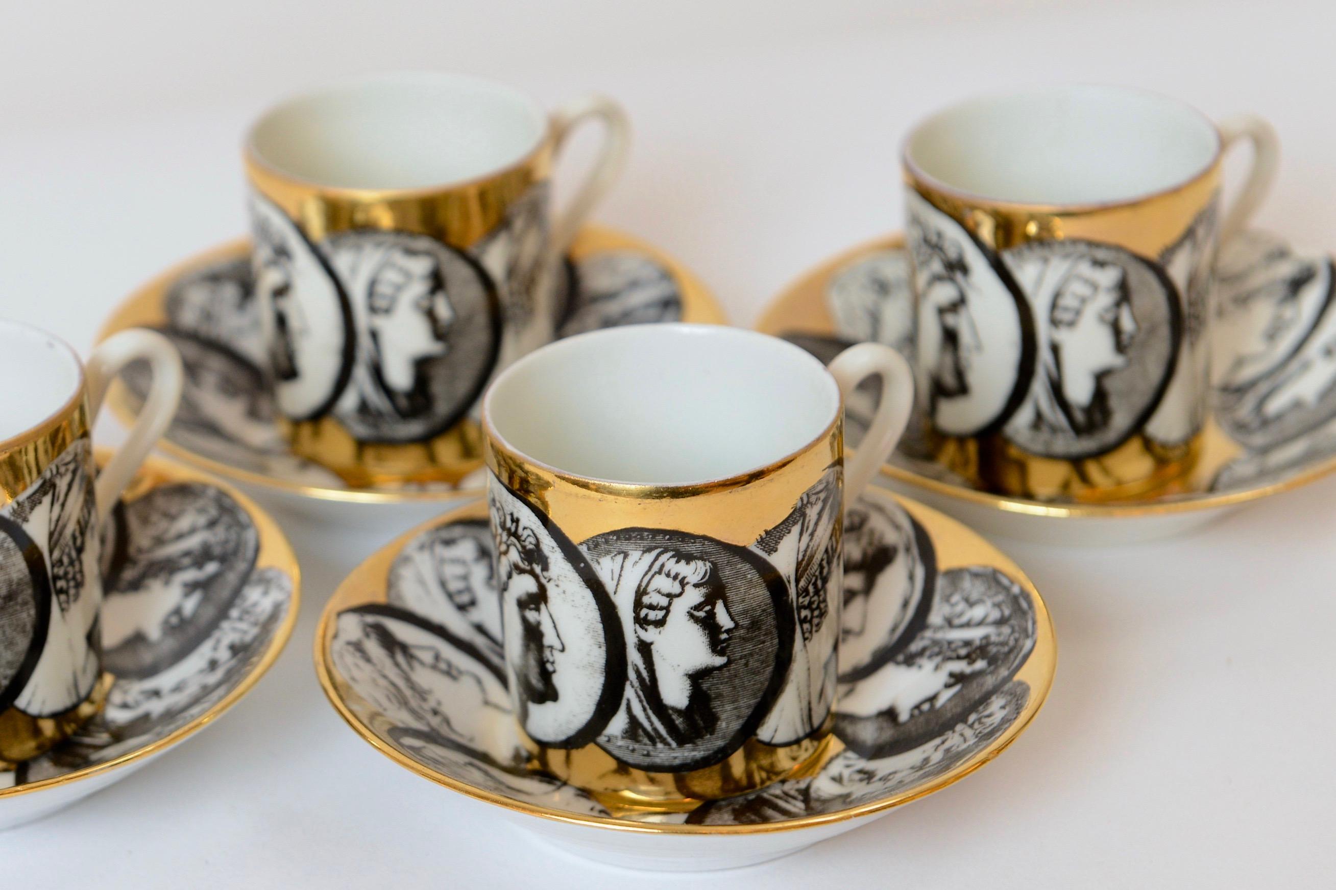 A rare and early set of four espresso cup and saucers designed by Piero Fornasetti, circa 1950. Produced by the historic Italian ceramic company, Richard Ginori, these beautiful porcelain pieces depict Mr Fornasetti’s ‘Cammei’ design of various