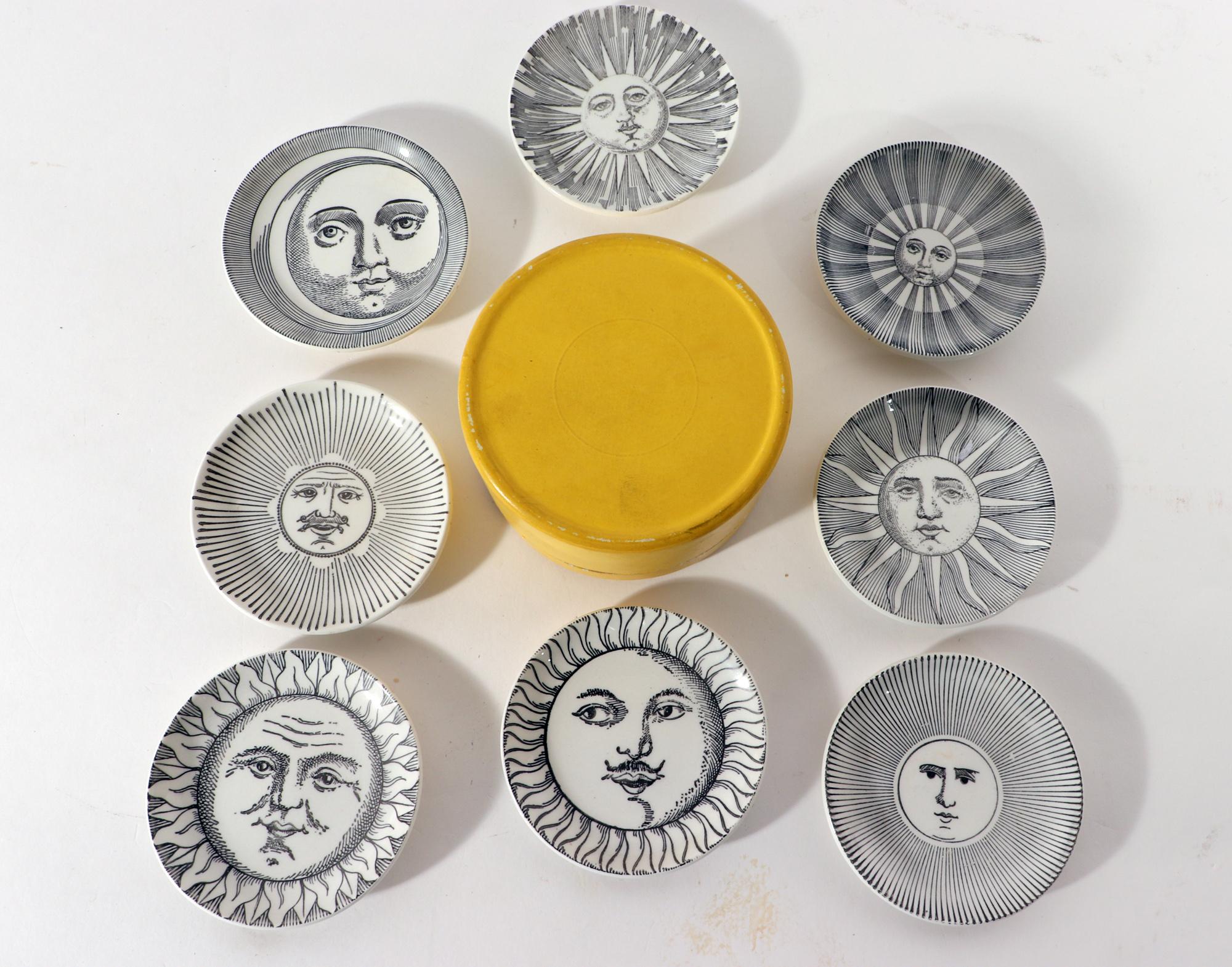 Piero Fornasetti Soli e Lune ceramic coasters with original yellow box,
1950s

The early Piero Fornasetti ceramic coasters are each decorated with a different image of the Sun or the Moon. These were designed to hold a cocktail snack such as