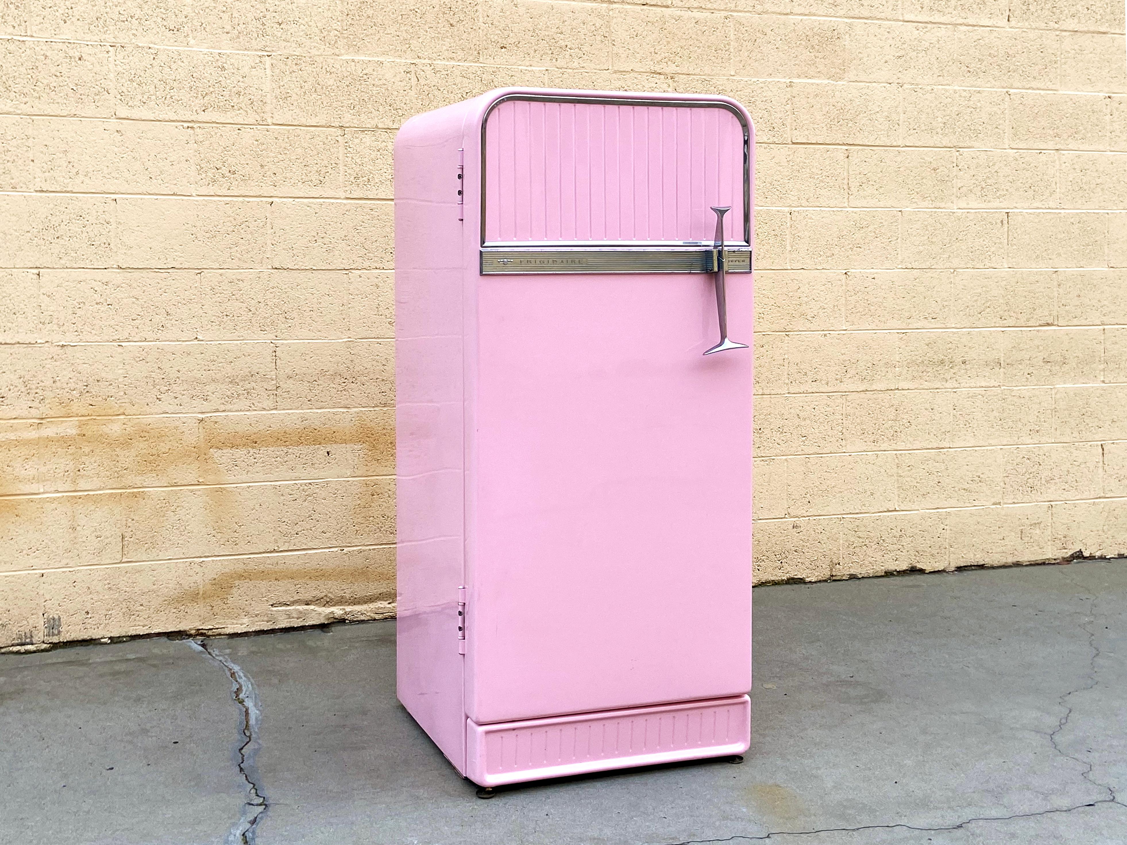 This 1950s Fridgedaire refrigerator looks like a dream! It functions too- seals tight and stays cool. In original condition with only minimal wear to paint. Some pitting can be seen on aluminum trim and interior plastic shows a bit of wear around