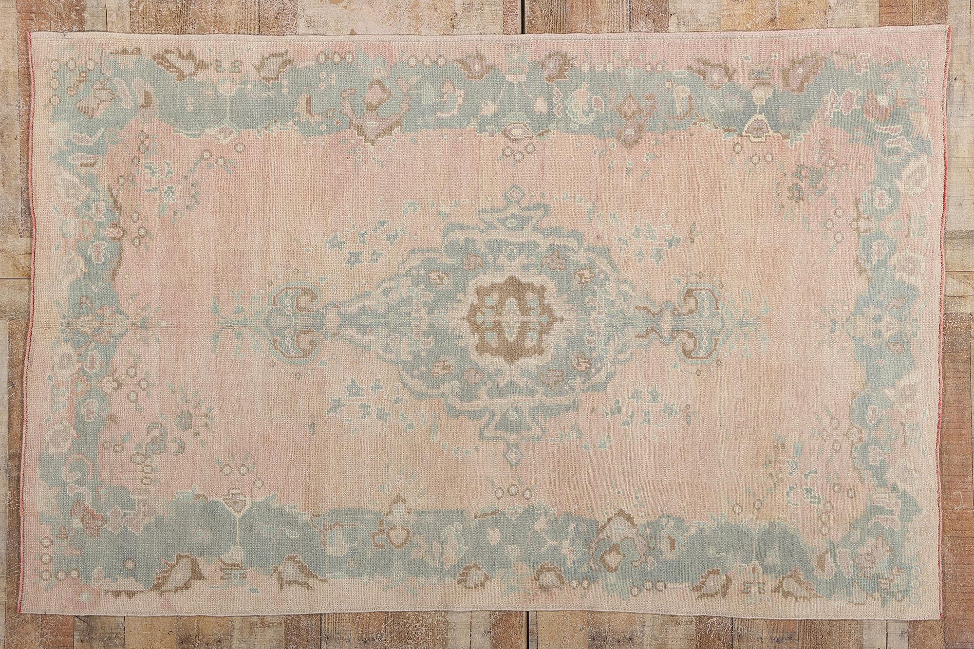 53996 Vintage Pink Turkish Oushak Rug, 04'10 x 07'07. In this exquisite hand knotted wool vintage Turkish Oushak rug, the spirit of nature dances across a dreamlike canvas. At its heart, a cusped pale verdigris medallion unfurls like a secret