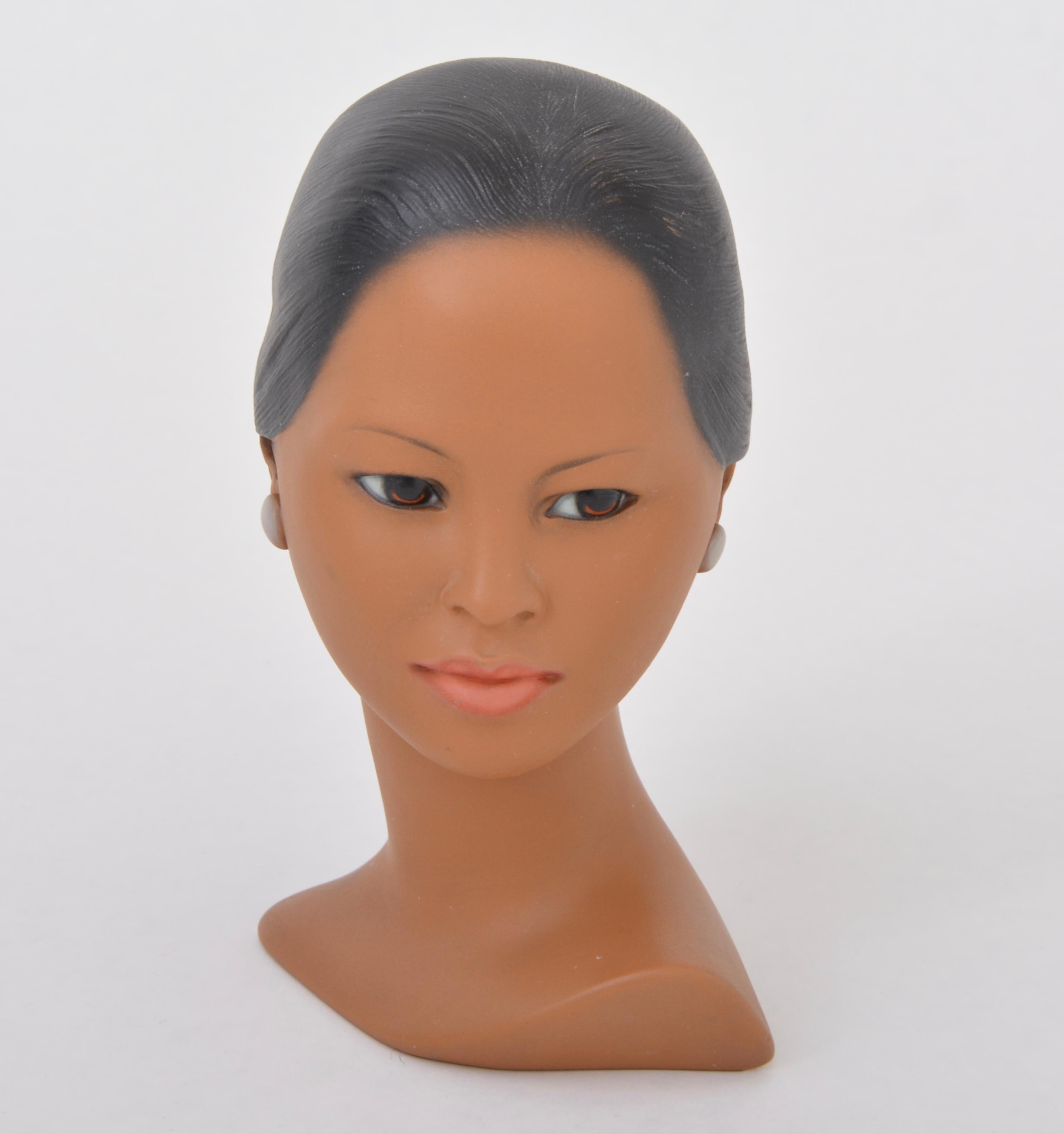 Danish Mid-Century Modern Plaster bust of a Polynesian beauty by Edith Pedersen

This bust was made in Denmark in the 1950s by Edith Pedersen. It is made of plaster and was painted by hand. It resembles the Marwal busts of the same era. The artists