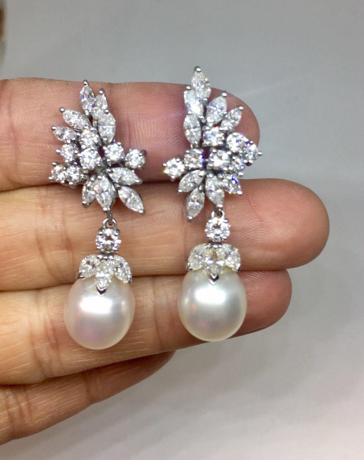 Stunning Estate Pair Platinum 5.60ct VS Diamond South Sea Cultured Pearl Pendant Earrings

Absolutely gorgeous high quality diamond and pearl earrings feature 16 round and 24 marquise-shaped diamonds totaling approximately 5.60 carats,

2 oval