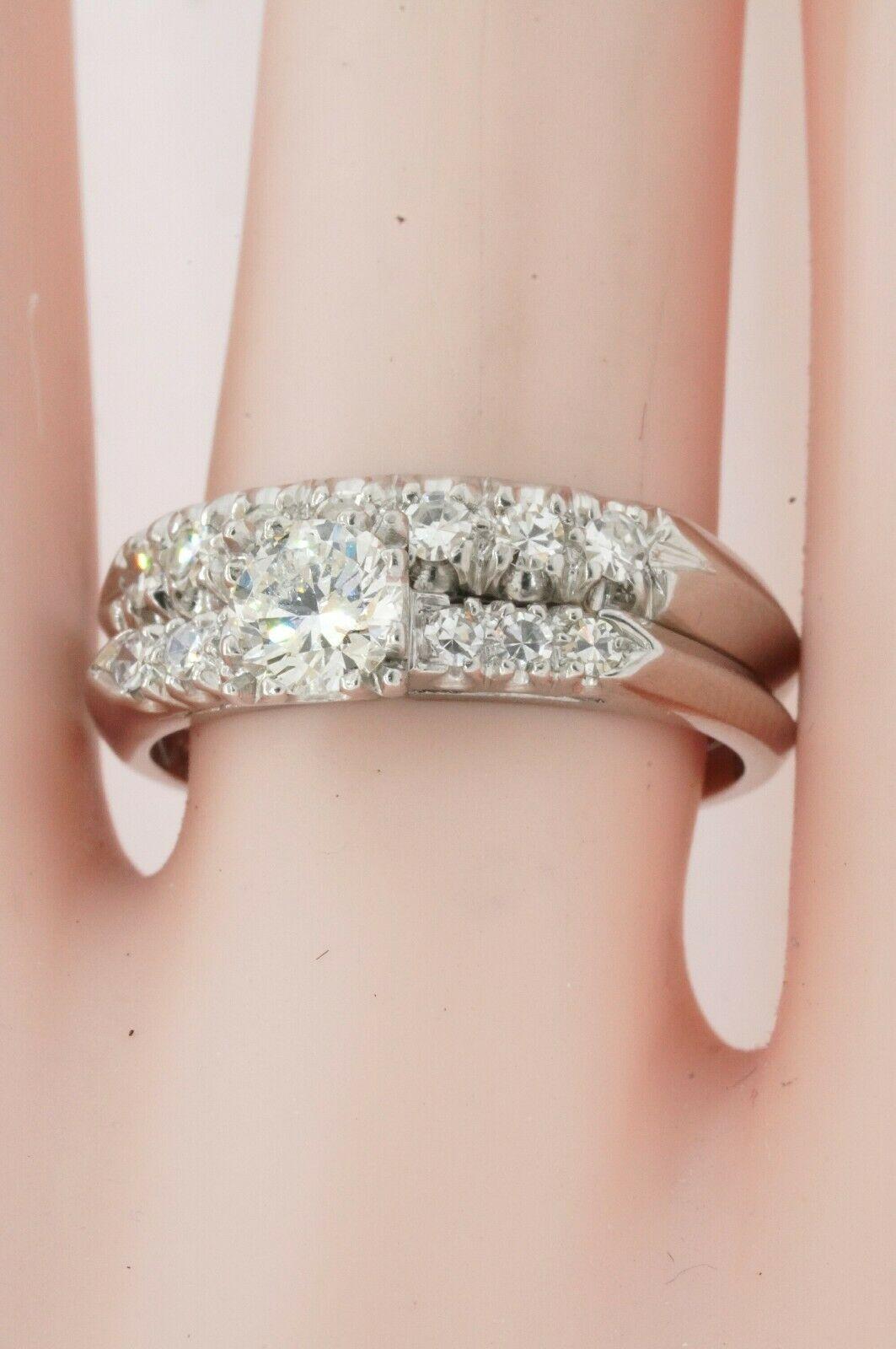 1950's Platinum .95CTW VS diamond bridal/wedding ring set w/ .56CT ctr. size 7.25. This marvelous ring set is crafted in gorgeous Platinum & features 14 Excellent VS-1 clarity/Colorless G color diamonds, with a combined weight of approx. .95CT. This