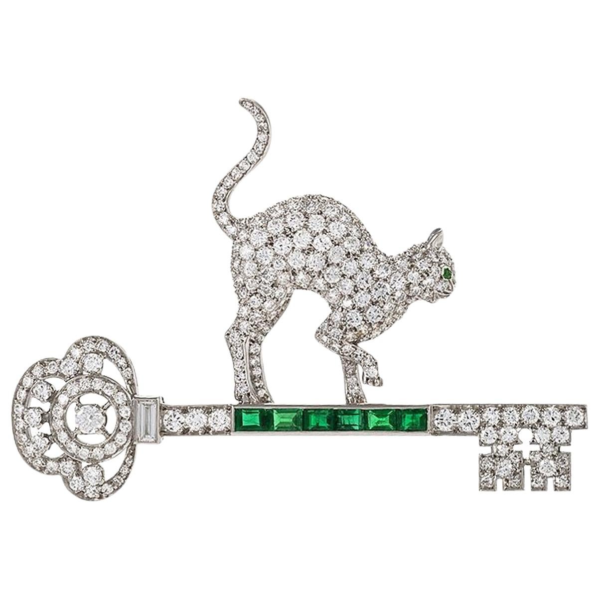 1950s Platinum, Diamond and Emerald Cat and Key Brooch