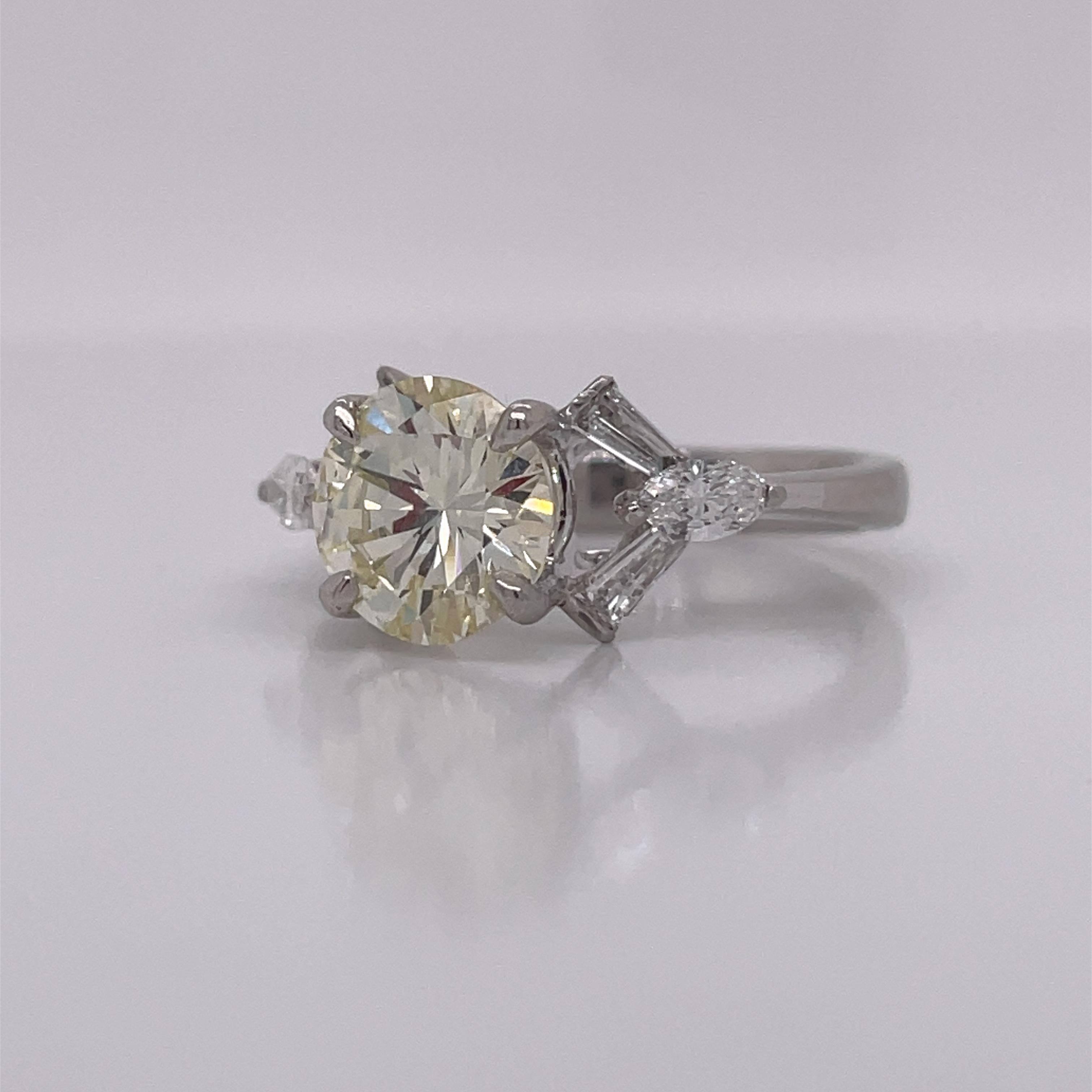Round Cut 1950's Platinum Diamond Ring with Tapered Baguettes For Sale