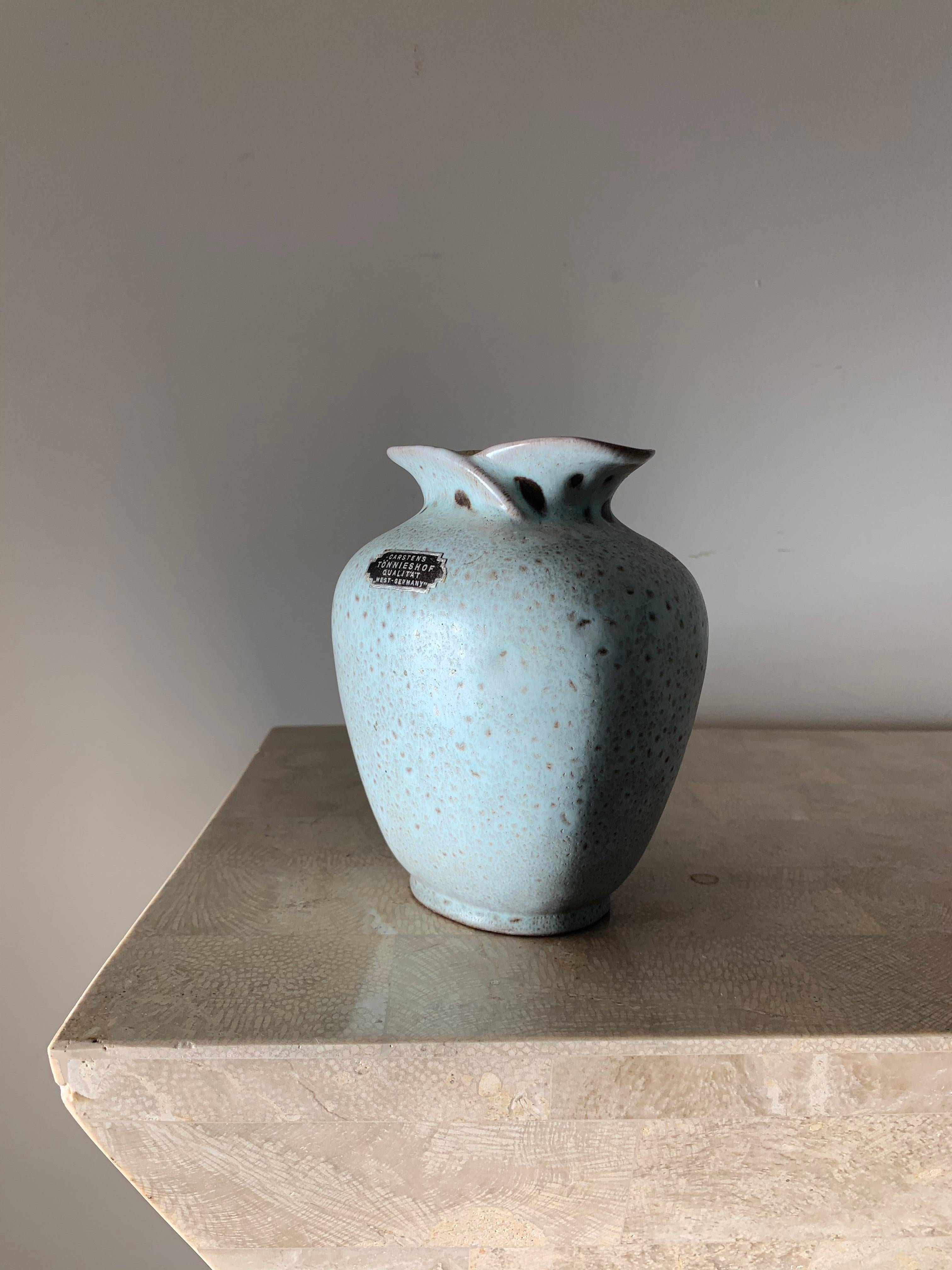 A pockmarked vase by Carstens Tönnieshof in pale robin’s egg blue with textured pewter punctures. West Germany circa mid 1950s - early 1960s. Flawless. 
4.25” W x 3.5 D x 5” H.