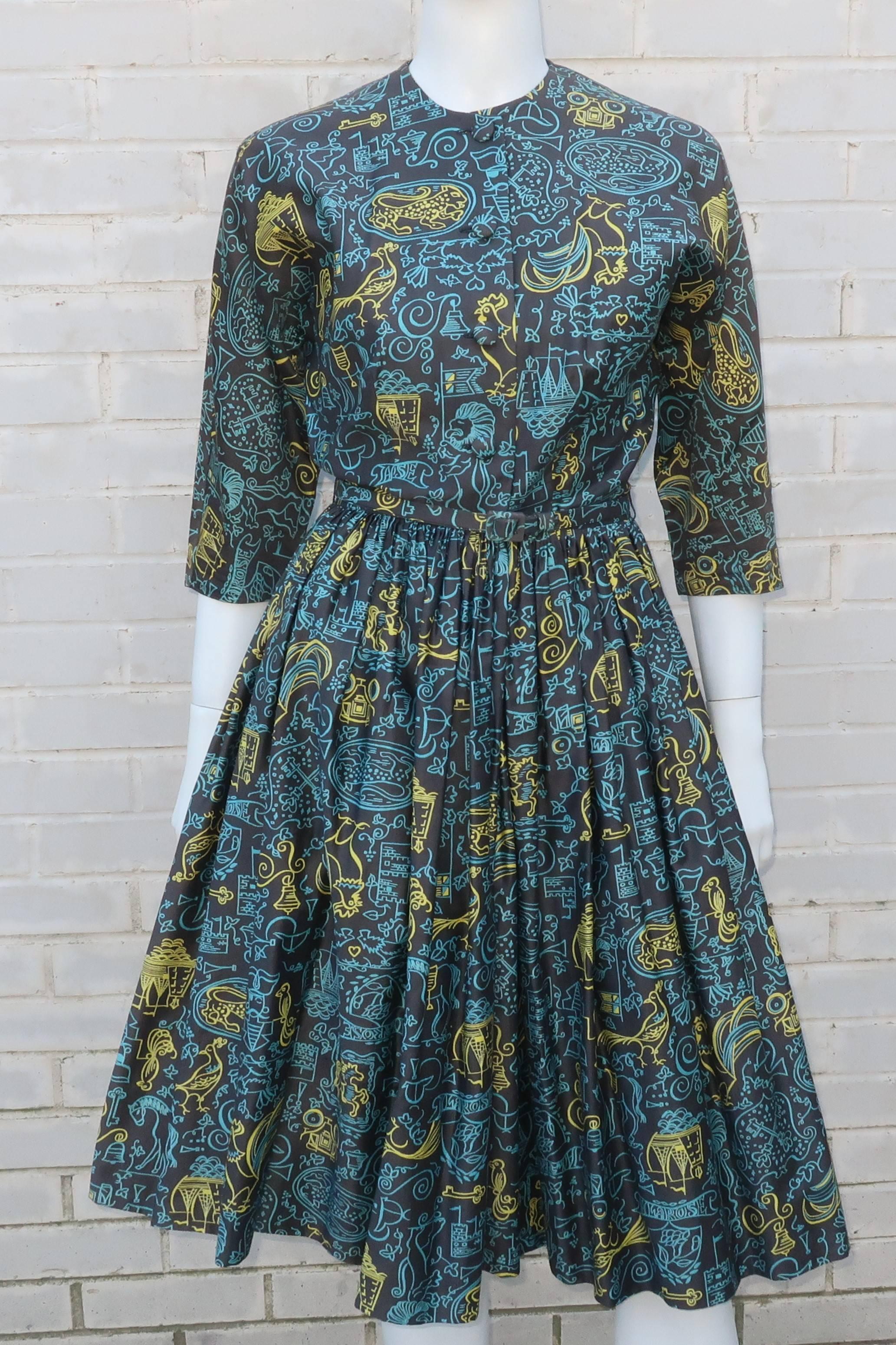Crisp and neat as a pin!  This classic 1950's shirt dress buttons and hooks at the front with batwing style 3/4 sleeves, a coordinating skinny belt and a full skirt.  The novelty printed polished cotton fabric depicts English castles, ships,