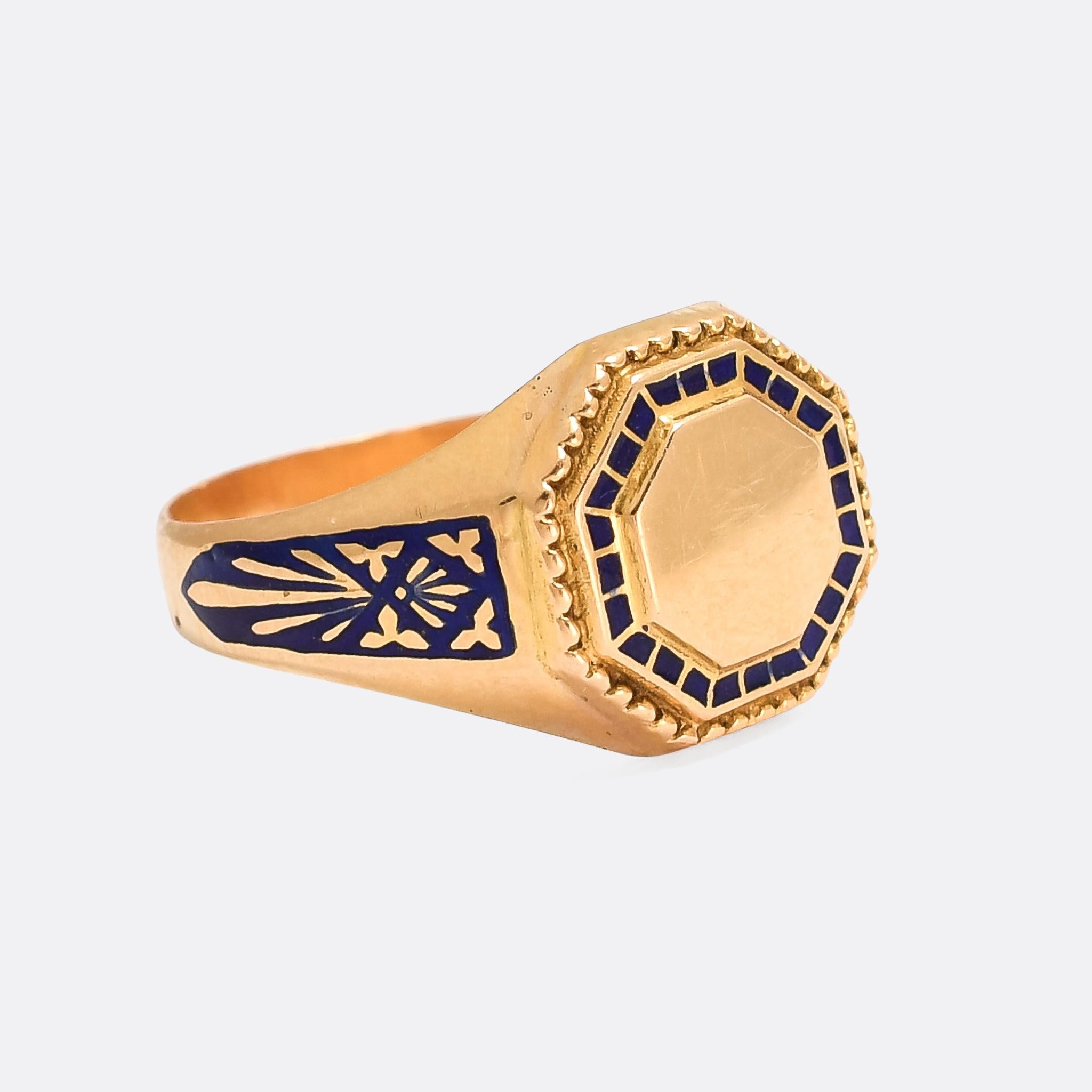 A spectacular and superbly made antique signet ring dating from the mid 20th Century. With an octagonal head and finished in fine blue enamelling, it's stylistically reminiscent of jewellery from the Etruscan revival period. It was made in Portugal,