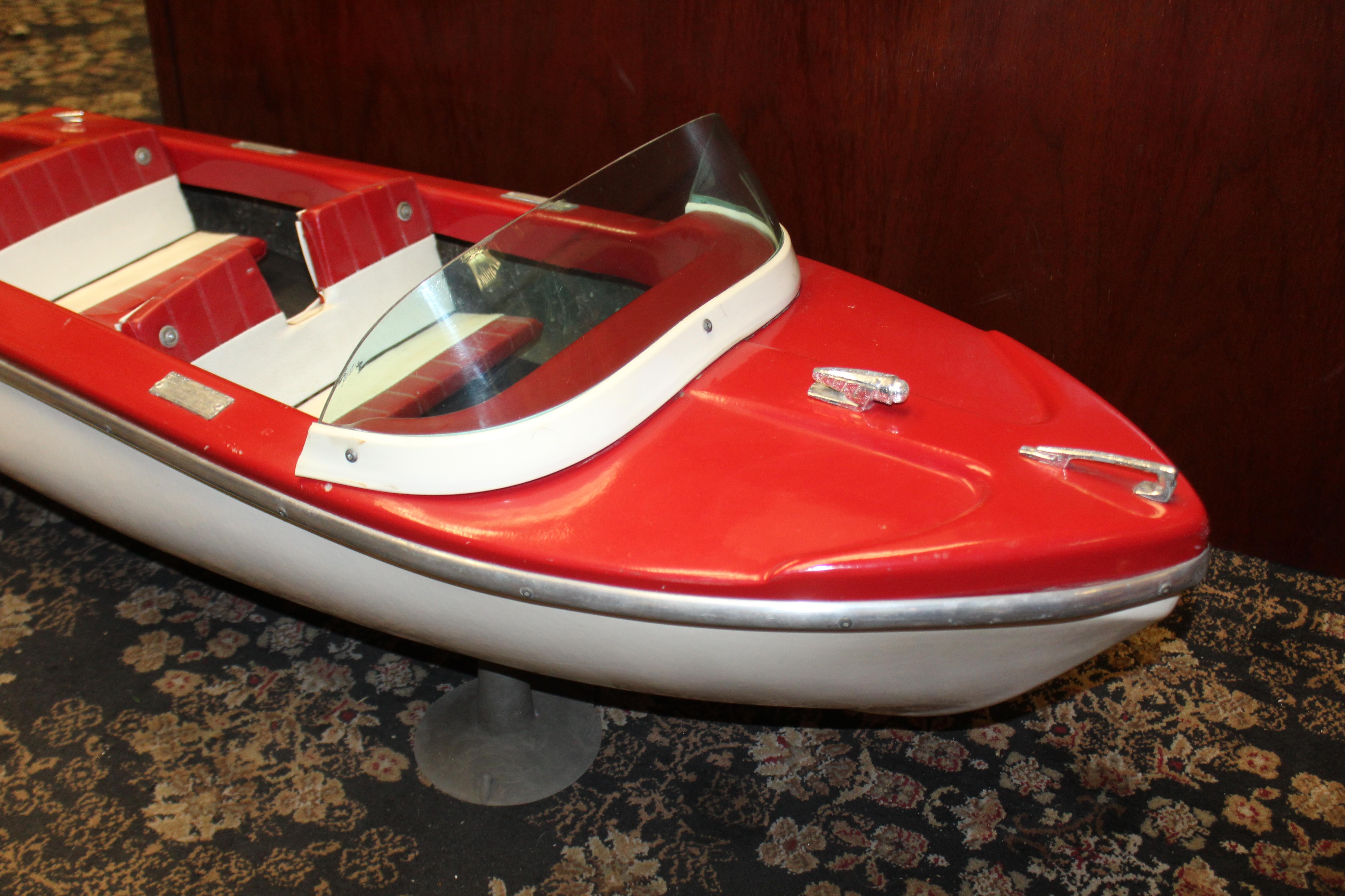 Fiberglass model boat Mfg by Aluminum Boat & Canoe. This is a smaller scaled boat with suction cups at the bottom of boat. This boat was most likely a salesman sample or a window display for the store.