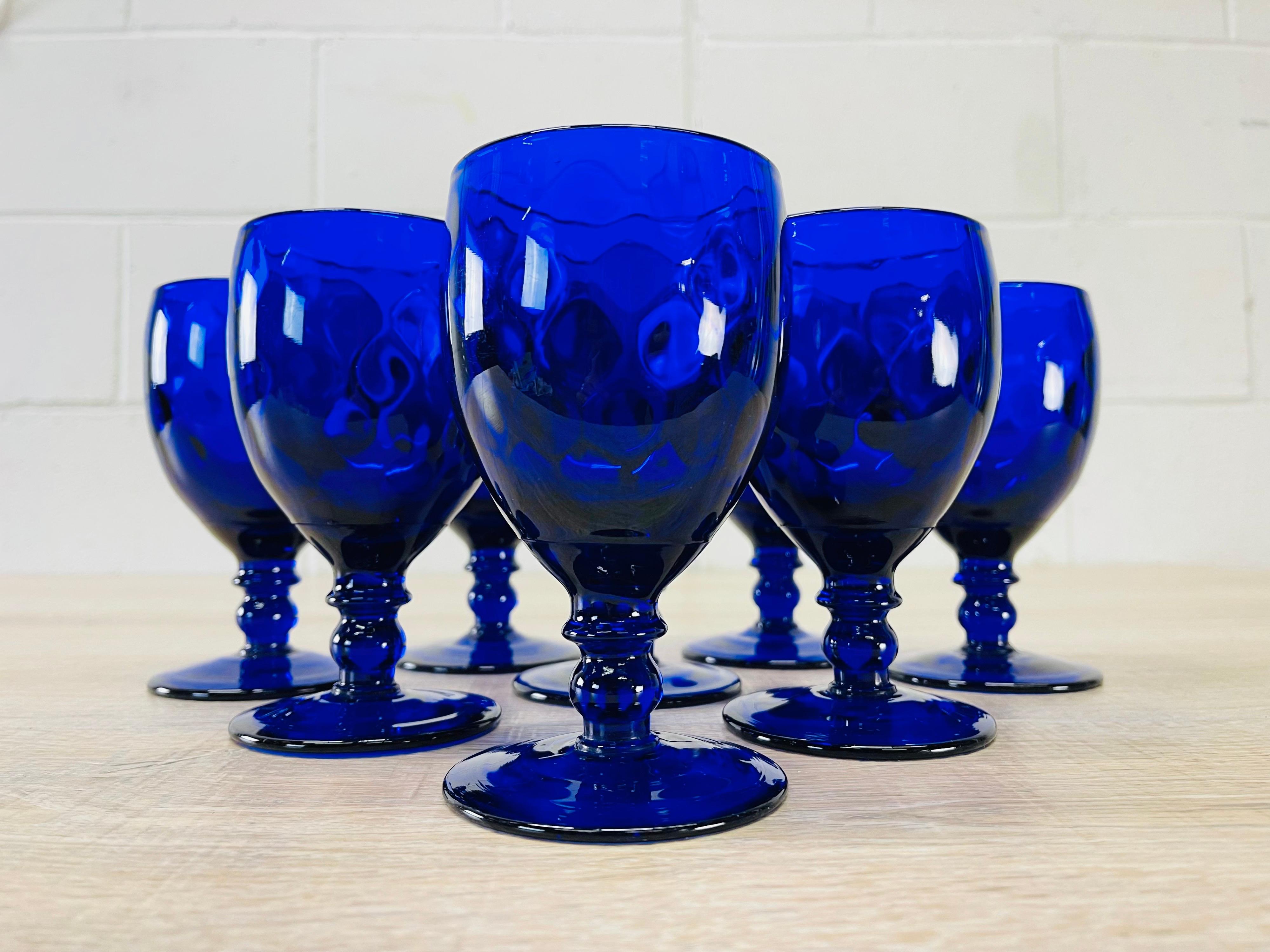 Vintage 1950s set of 8 quilted cobalt glass water stems. Quilted design with a ball stem. No marks.