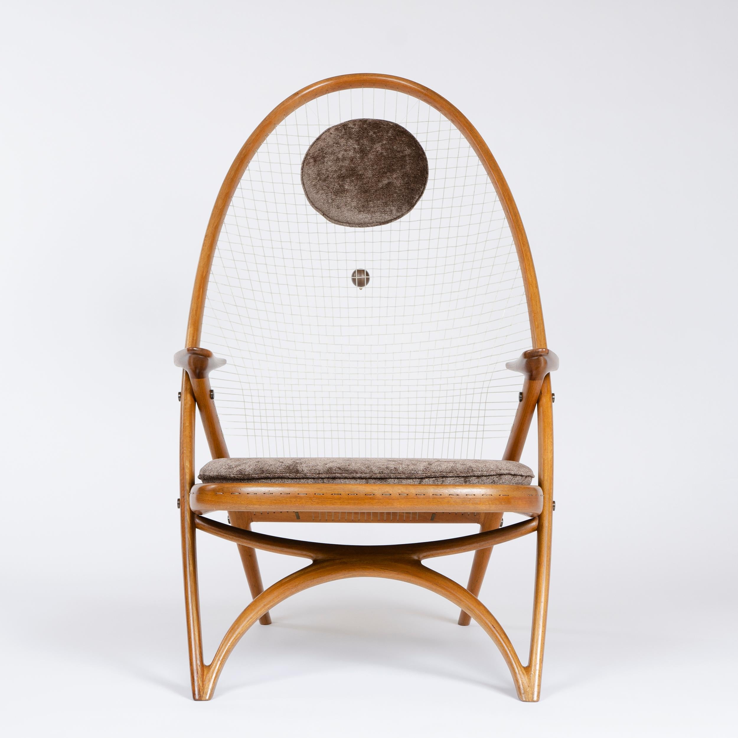 A rare easy chair designed by the architect Helge Vestergaard Jensen and executed by the cabinet-maker Peder Pedersen for the exhibition in 1955. The Racquet chair chair has distinct reminiscences of the Windsor chair though the modern lamination