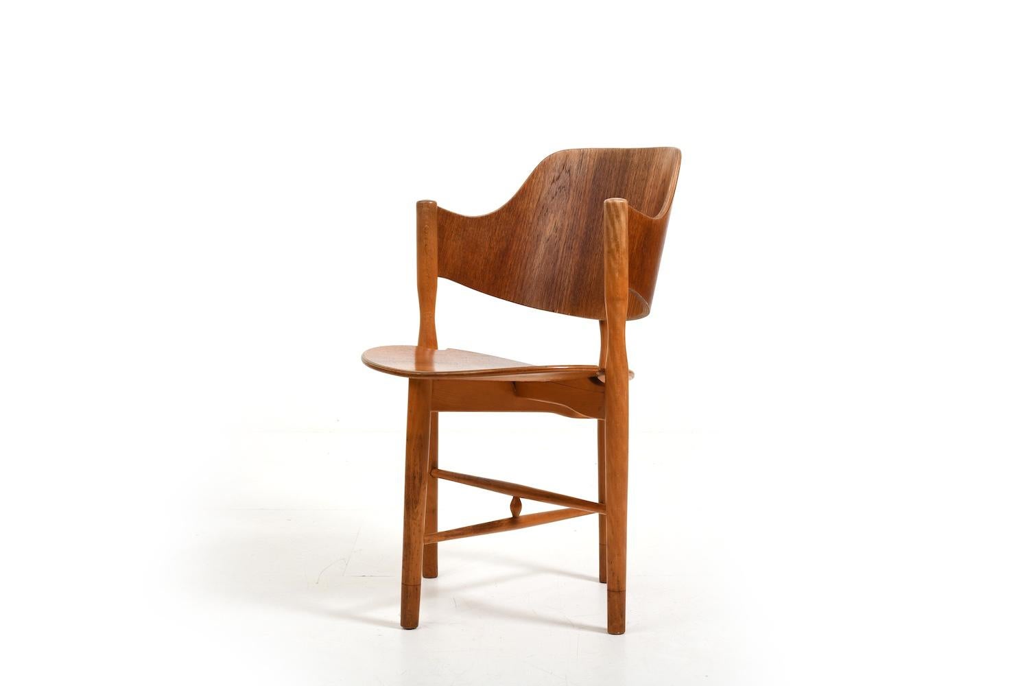 Beautiful shaped danish armchair 1950s. seat, backrest and legsend made in teak, base in beech. We dont know who made them, but looks like Hjorth or Kofod Larsen. Very good quality.