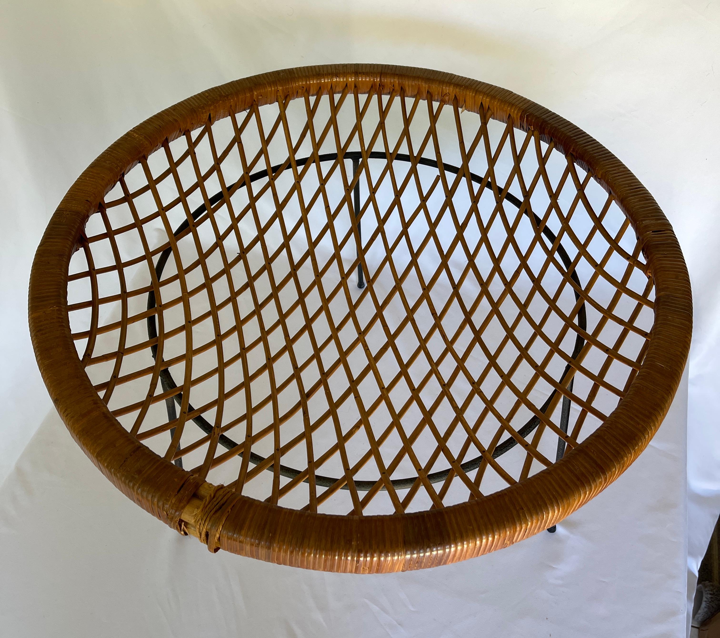 1950's rattan catch all table sits on circular Iron base with three legs. 
Rattan table top measures 27.5