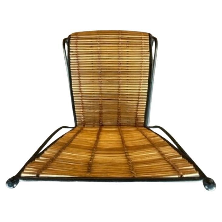 Rattan and Bamboo Side Chair by Pipsan Saarinen Swanson for Ficks Reed
Blackened steel legs
Angled seat back, and sculptural silhouette