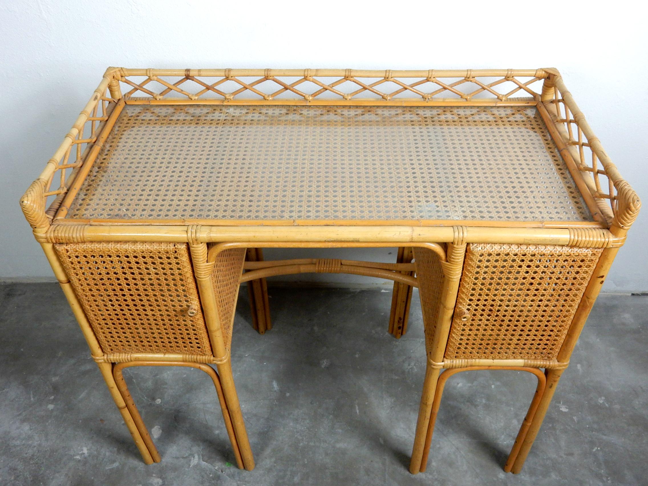 Gorgeous little letter desk constructed of bent cane wrapped in cane wicker.
Possibly from West Indies, circa 1950.
Glass writing top. Every part of this gem is as it was when created.
