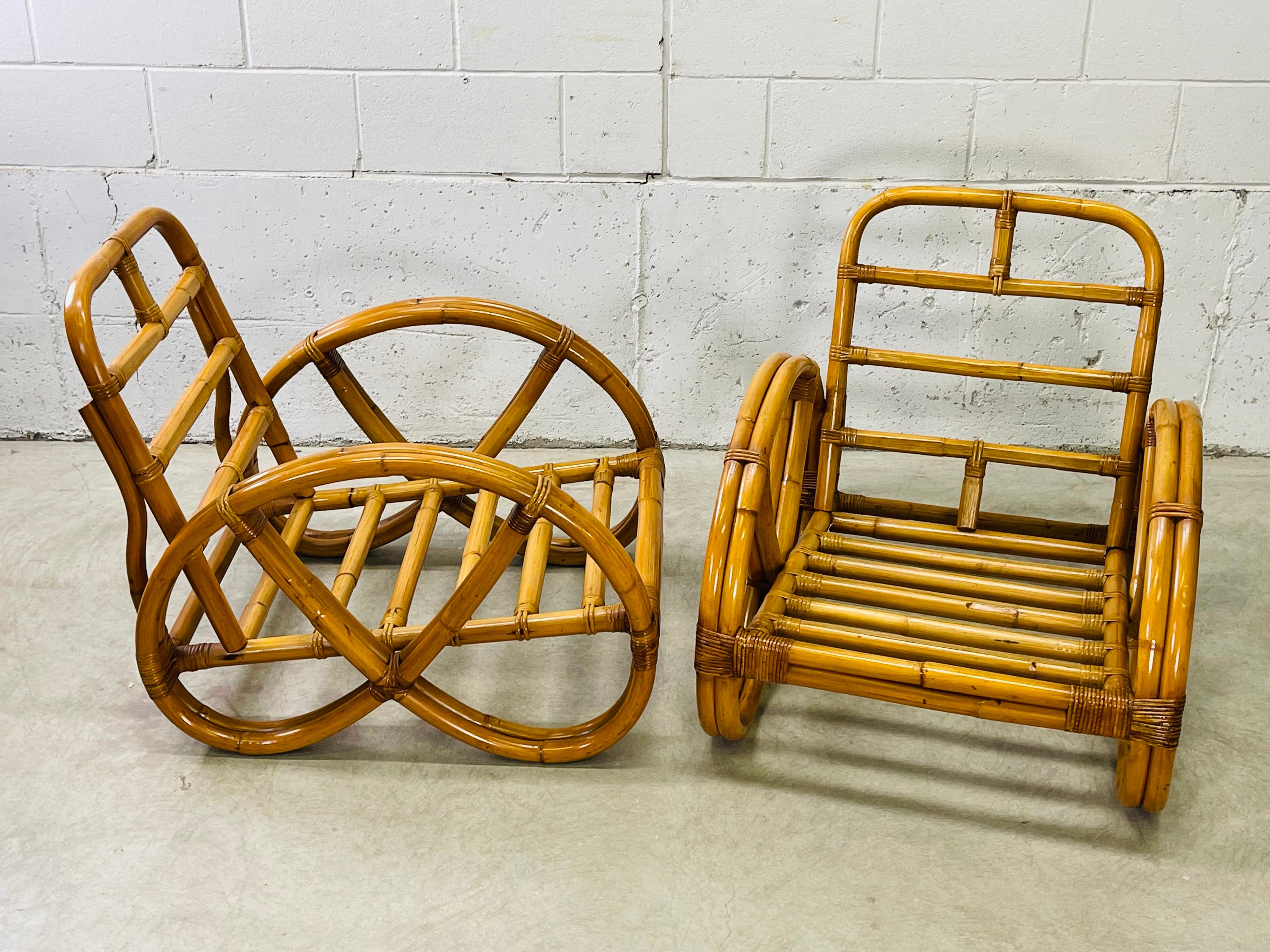 Vintage 1950s pair of rattan pretzel style two strand lounge chair frames. The chairs have a true pretzel design on the arms and they are in excellent condition. Solid and sturdy with no breaks in the rattan. No marks.