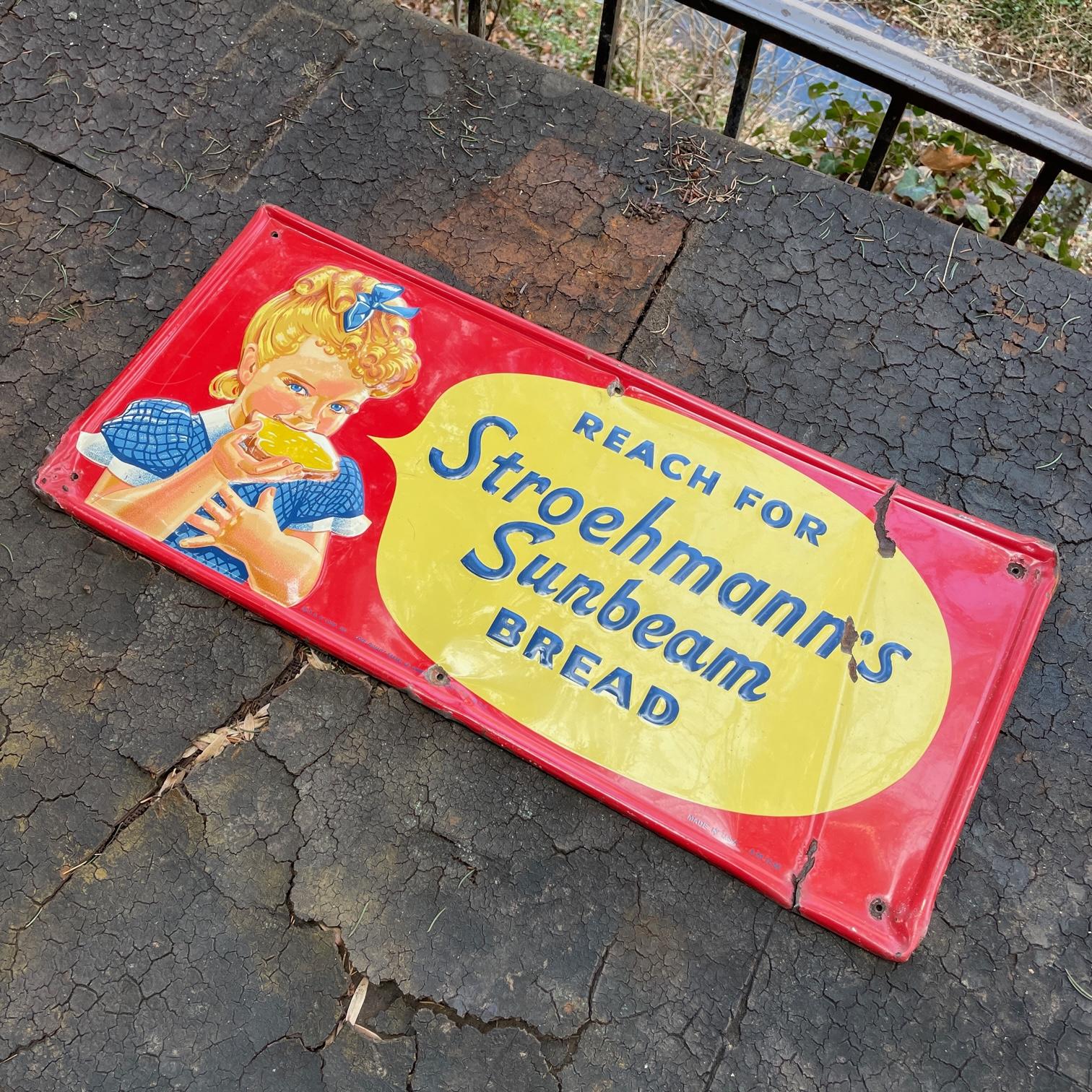 A very rare advertising campaign tin tacker sign. 'Reach for Stroehmann's Sunbeam Bread.' A single sided tin (SST) embossed sign. Marked Q.B.A. Coop Inc. Bank of America -------itive Inc. N.Y.C. Made in USA A-M-12-56. This is an ungraded sign, that