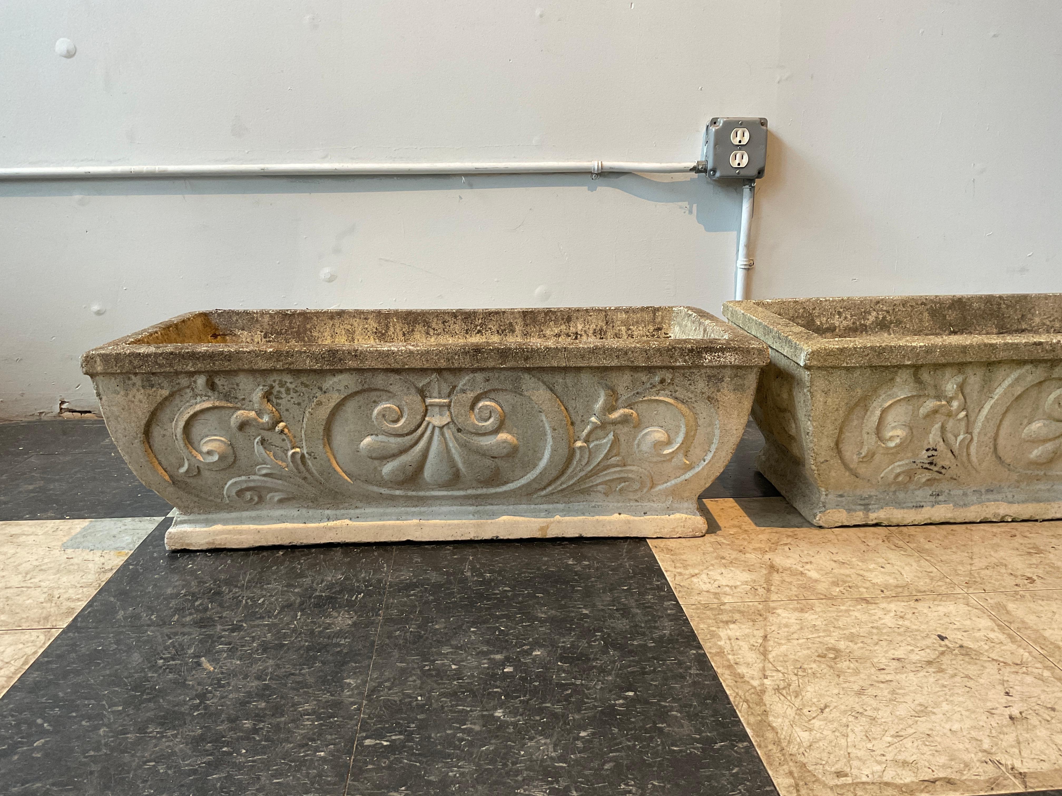 A pair of 1950s concrete planters. There are 4 pairs available. The price is 975 per pair.