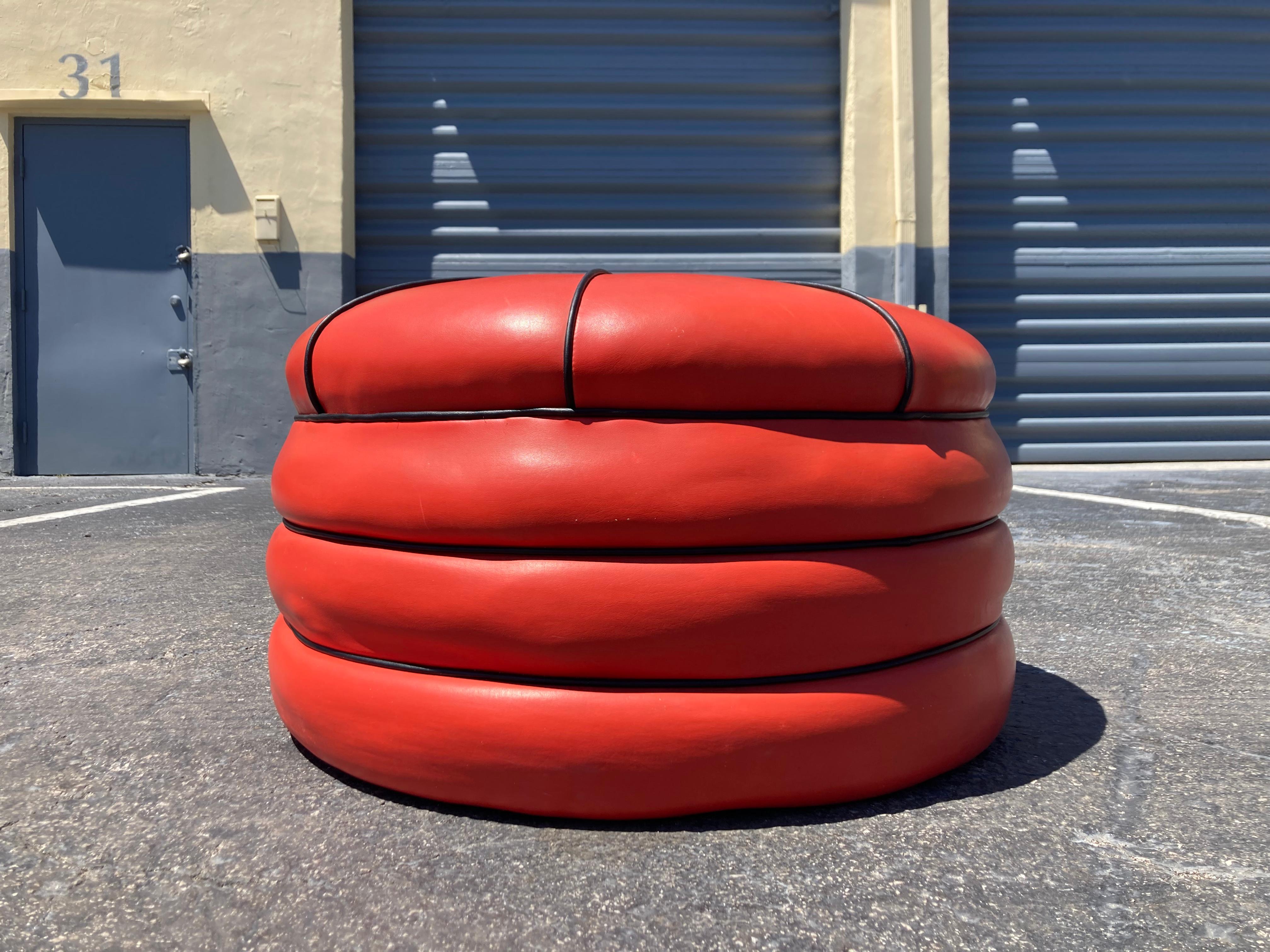 red leather pouffe