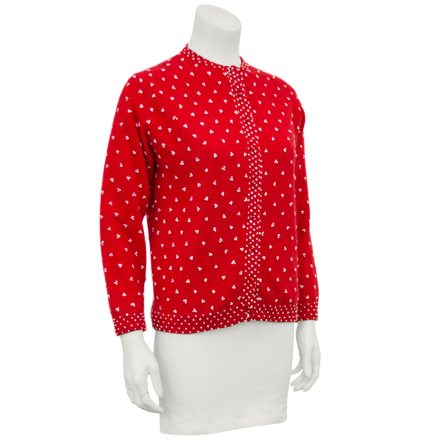 Chic red knit 1950's cardigan with beige French knot details. So often these cardigans are sequinned or embroidered, or both. This version has all the look but can be worn day or night. Fresh clean condition, fully lined and ready to wear. Feels