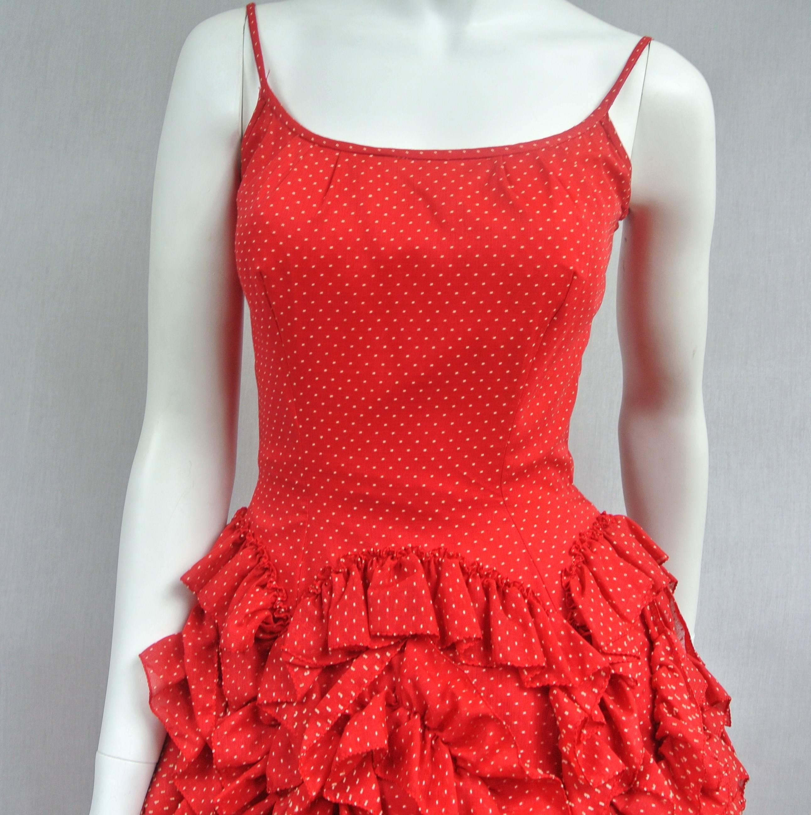 Spectacular! I look at this dress and think Flamingo Dancer with a Full Layered Ruffled skirt. Very tiny Polka Dot motif. Lined and the dress fabric is backed. Summer fun in this dress! Excellent condition. Measurements as follows:---32 Bust- 24