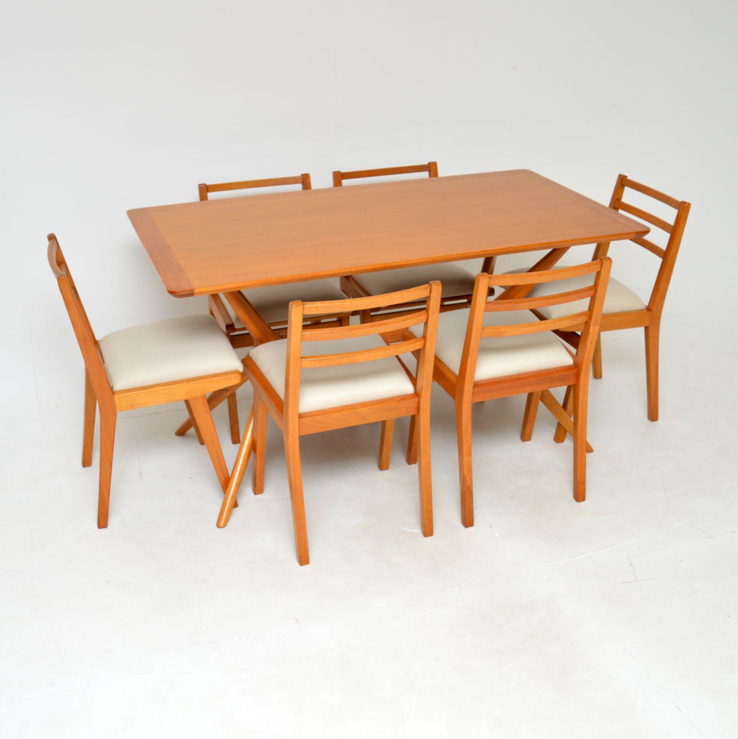 A stunning original vintage dining table and chairs from the Redford range by E. Gomme, later known as G plan. This was made in England, it dates from the 1950’s.
The construction is solid oak, which has been polished to a gorgeous light colour