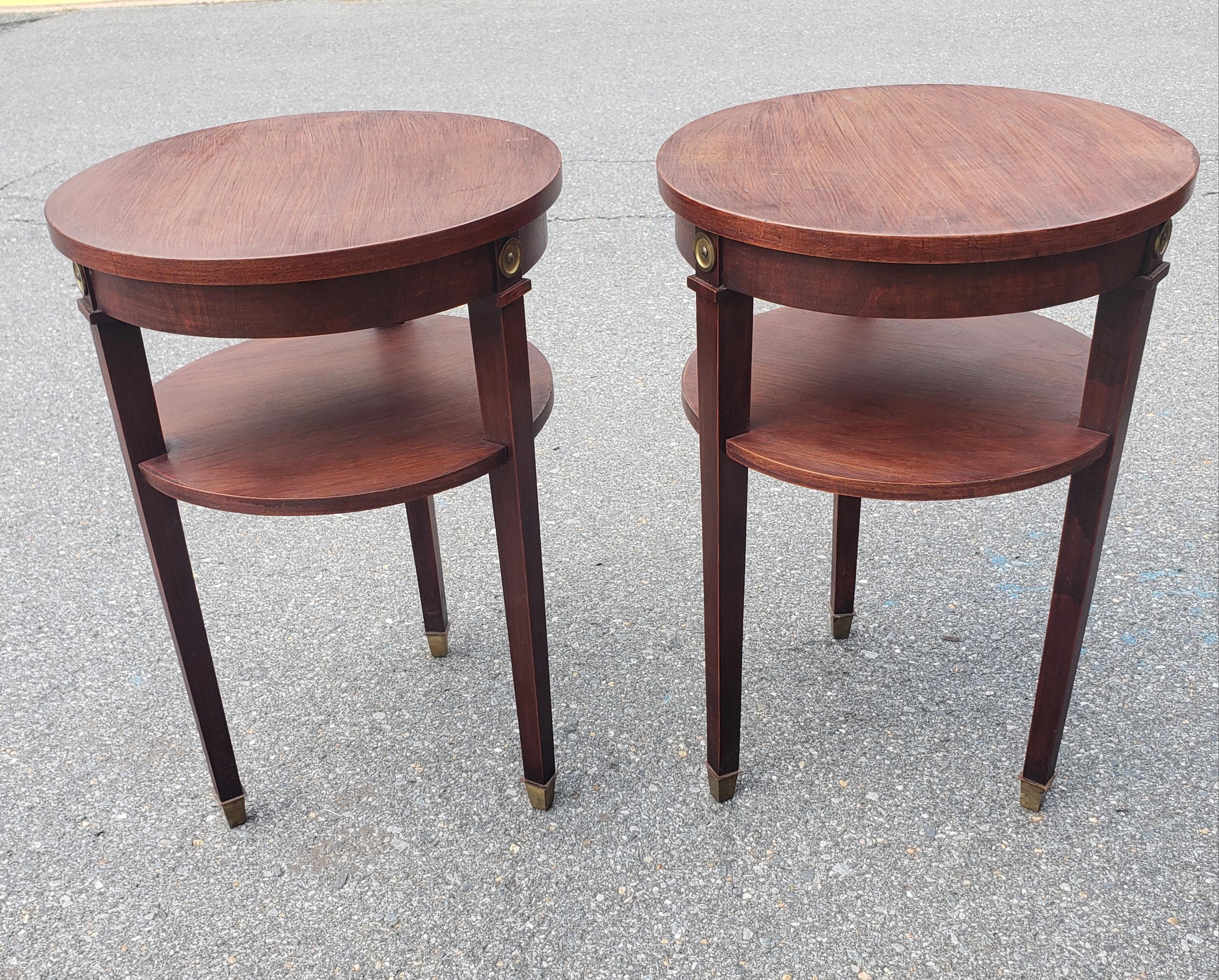A midcentury Refinished Mahogany tiered round candle stands or Lamp Tables, side tables with tripod brass capped legs.
Very sturdy. Great vintage condition. Measure 17.5