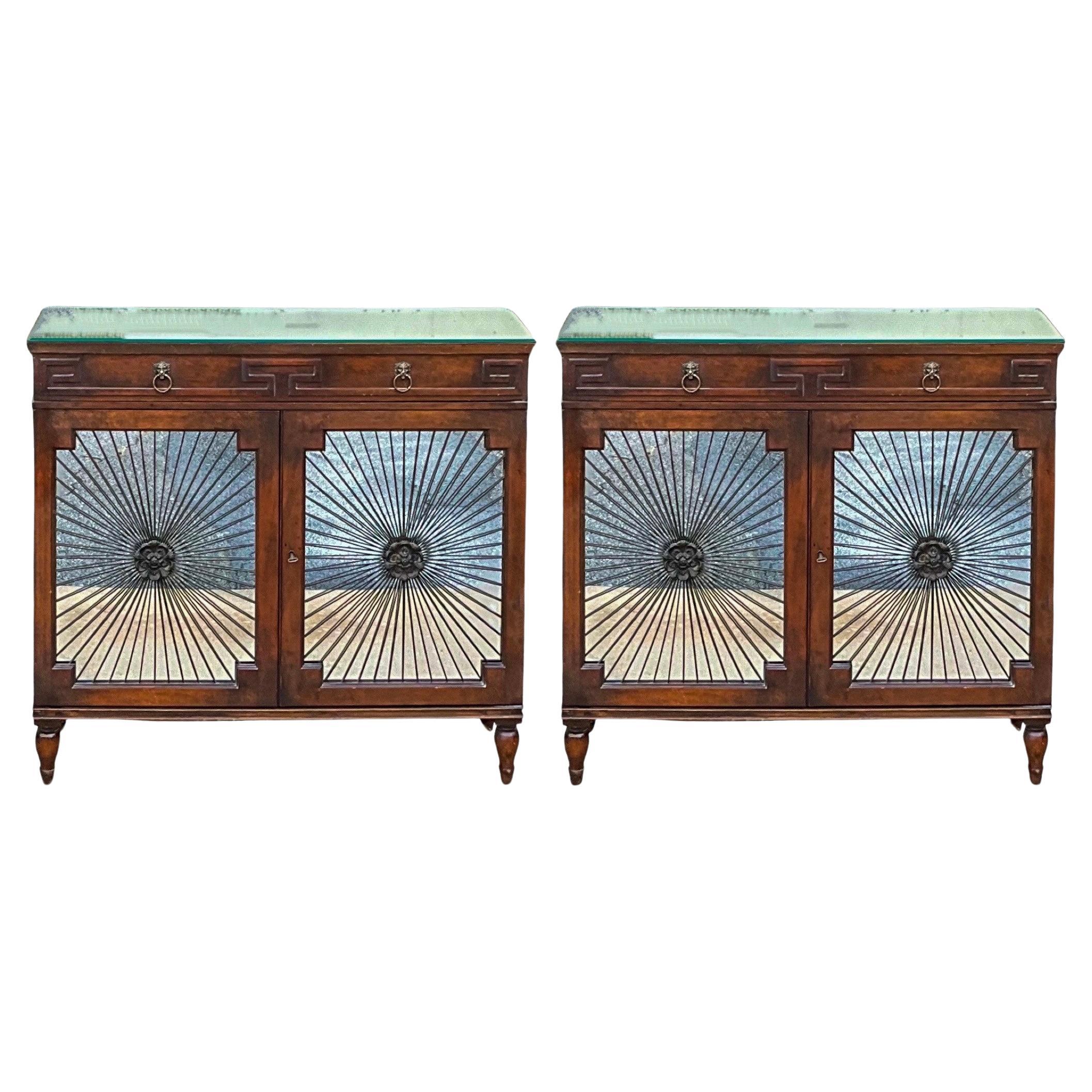 This is a pair of 1950s regency style mahogany cabinets with mirrored starburst fronts and mirrored tops. The cabinet opens to a single shelf. There is a key. They are unmarked and in very good condition.

My shipping is for the Continental US only,