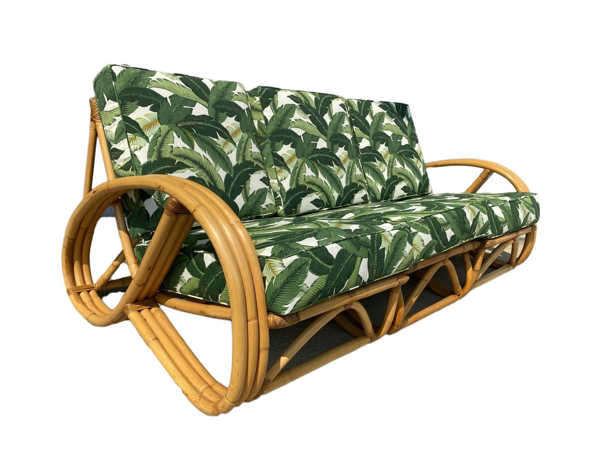Three-strand 3/4 reverse pretzel arm rattan living room set with a sectional sofa and lounge chair sofa features a decorative wave detail on both sides of the base. Also included in the set is a matching ottoman. Reminiscent of the sofas done by