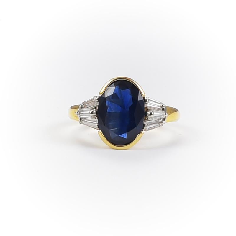 1950's 18k gold engagement retro ring with 1 sapphire 4.20 carats and 6 tapered cut diamonds 0.50 carats.