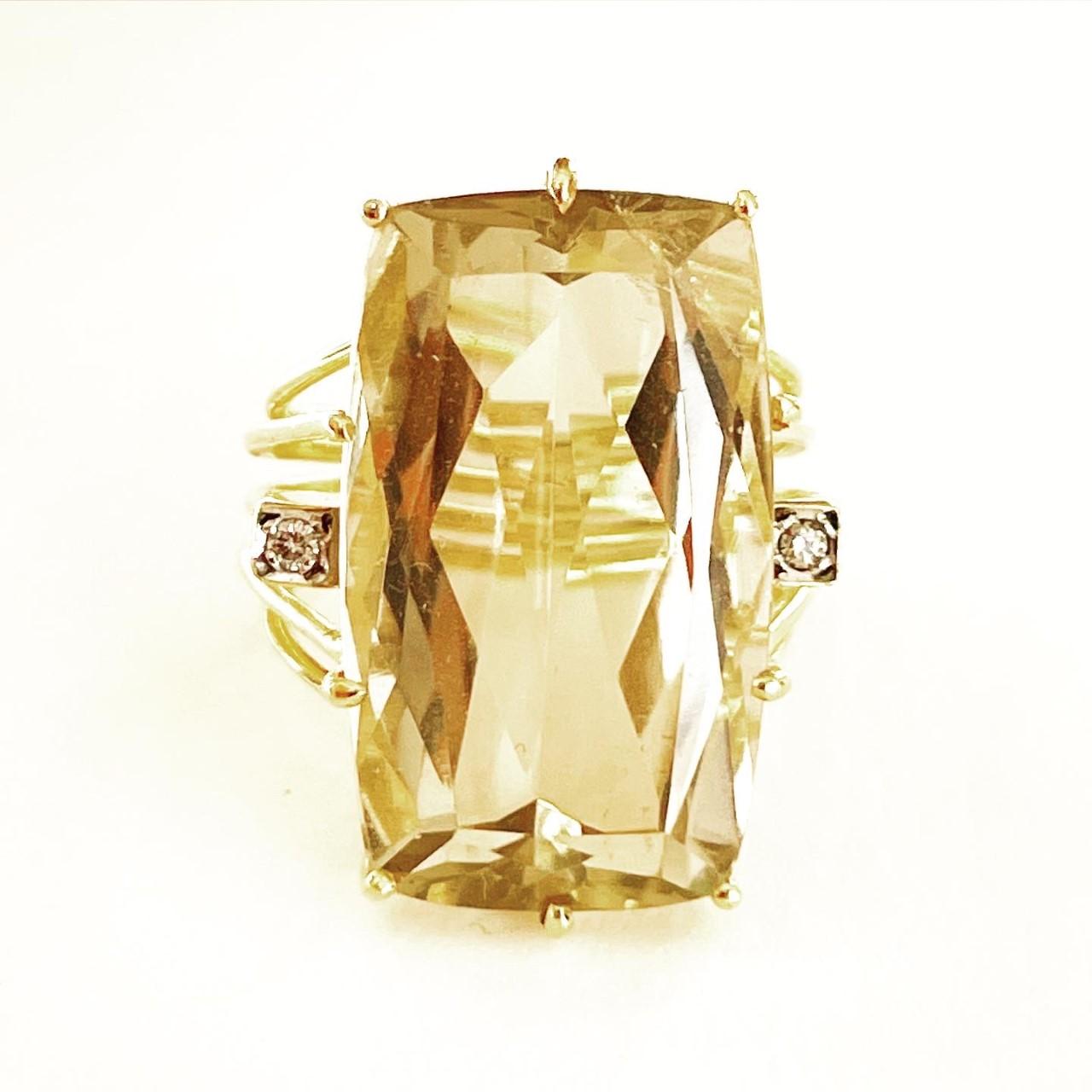Beautifully designed and handcrafted in 18 karat yellow gold, this Retro cocktail ring from circa 1950 features a lovely Citrine measured to weigh approximately 23.5 carats and diamonds.
Superb tank ring, linear and geometrical design typical for