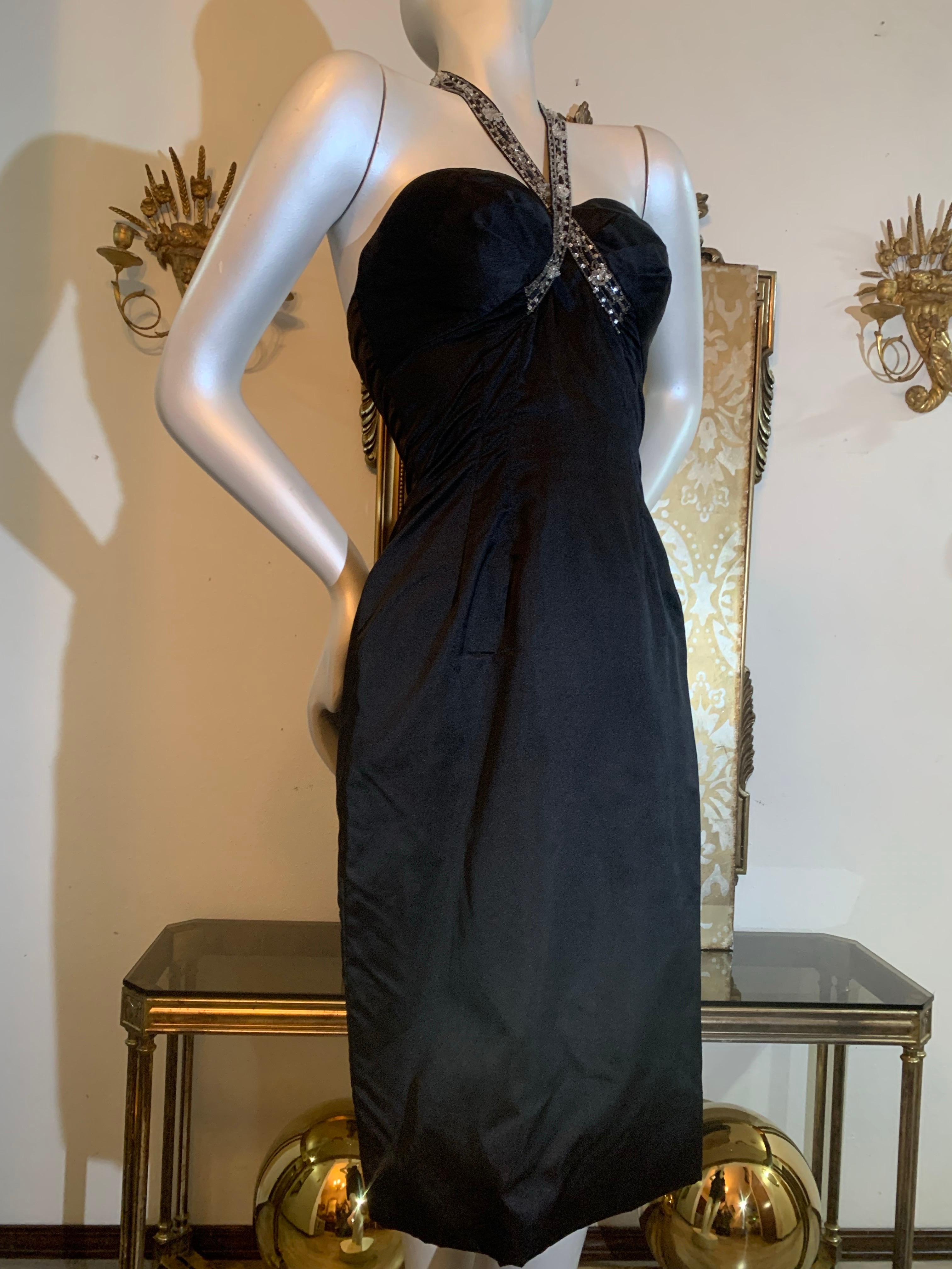 1950s Robert Morton Black Silk Satin Hourglass Sheath Dress w Beaded Criss-Crossed Halter Strap:  This is a really sexy dress, cut with an emphasis on curves!  A fitted boned-bodice sheath dress with gathered volume that swirls around bust to a